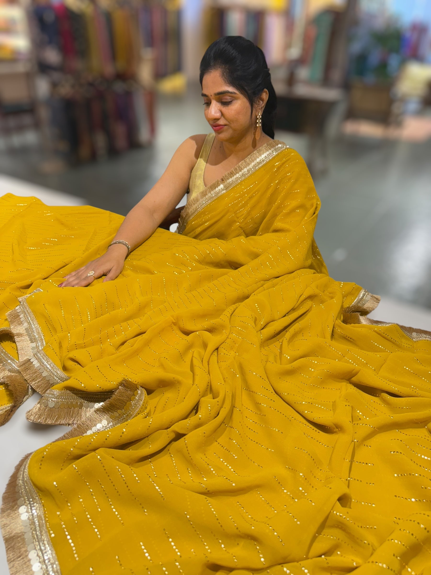 Yellow light Georgette Saree with stick on Badla in stripes pattern and kiran Lace