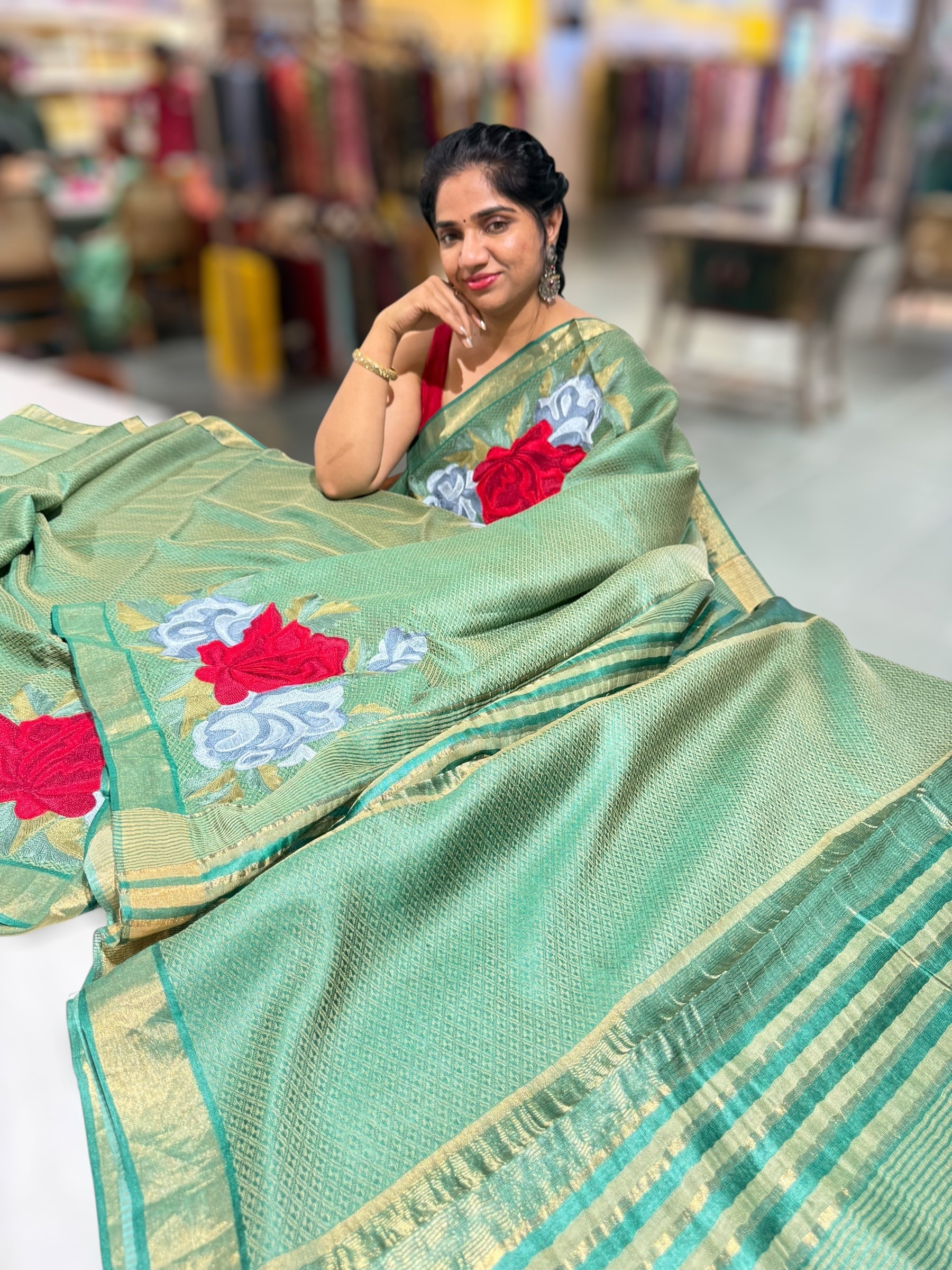Emerald Green Tussar Brocade Saree With Statement Red Rose Embroidery.