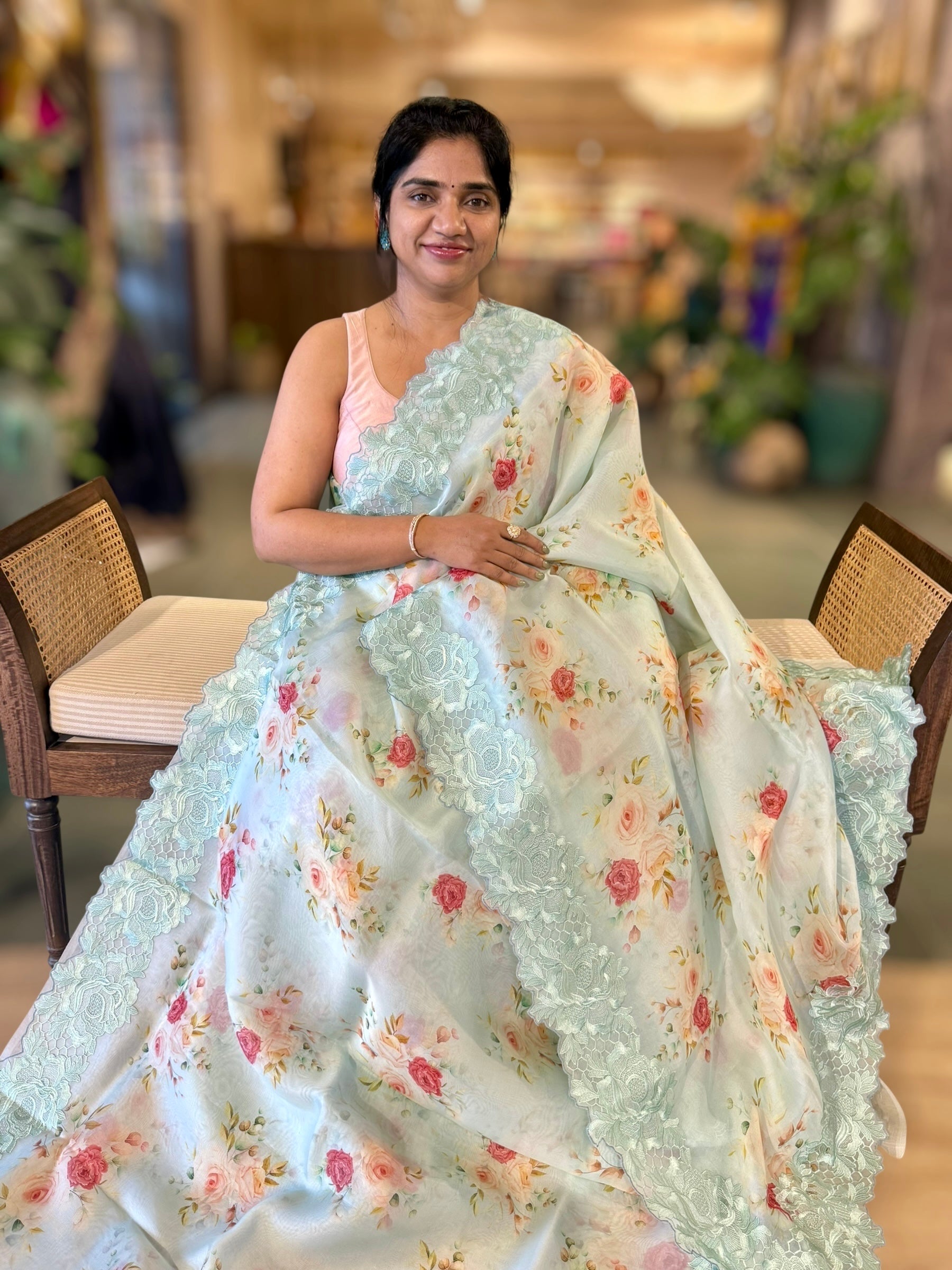 SeaBlue Printed Organza Saree With Chantilly Lace Style Embroidered Border.