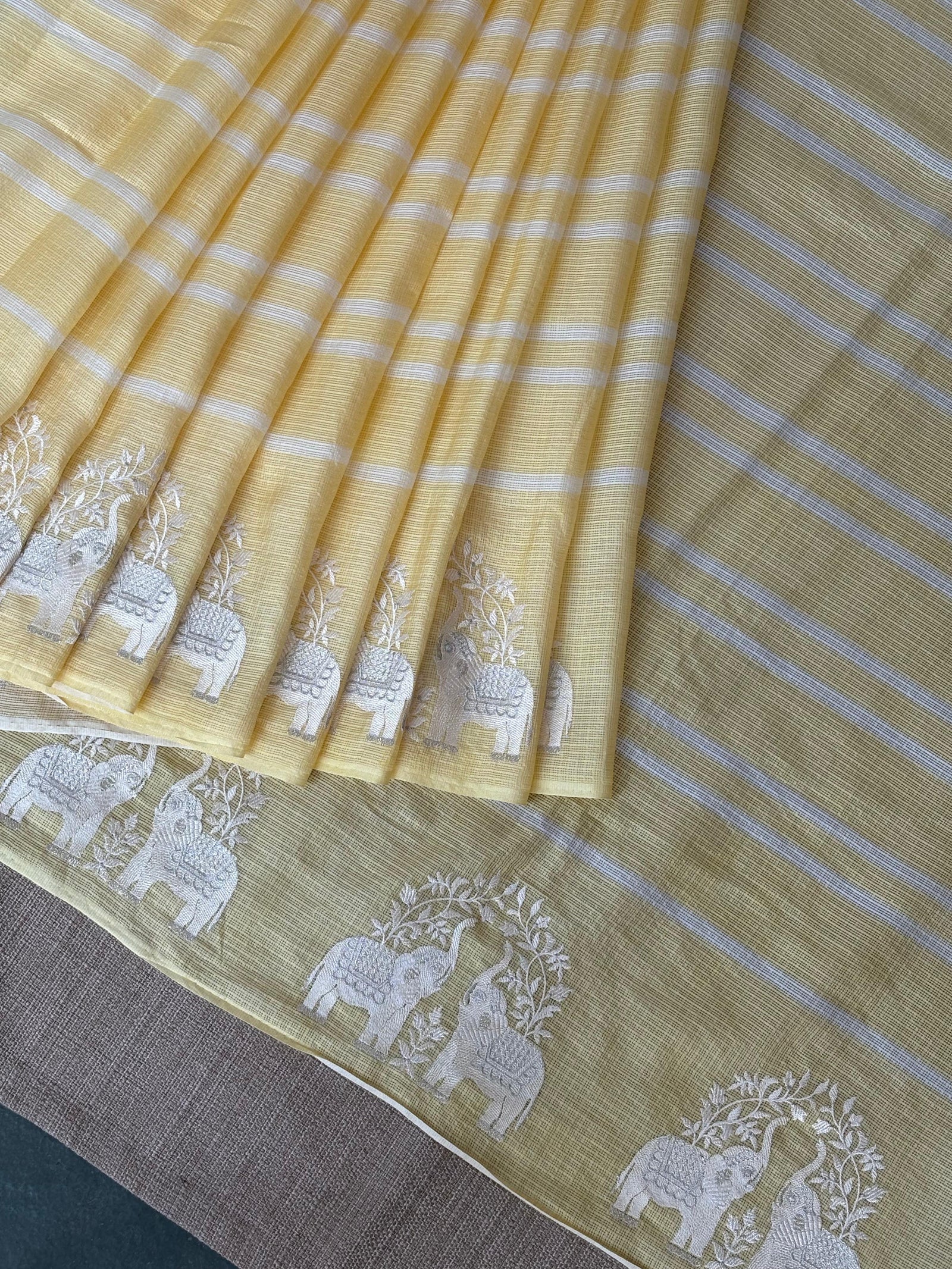 Pastel Yellow Designer Silk kota saree with elephant embroidered border