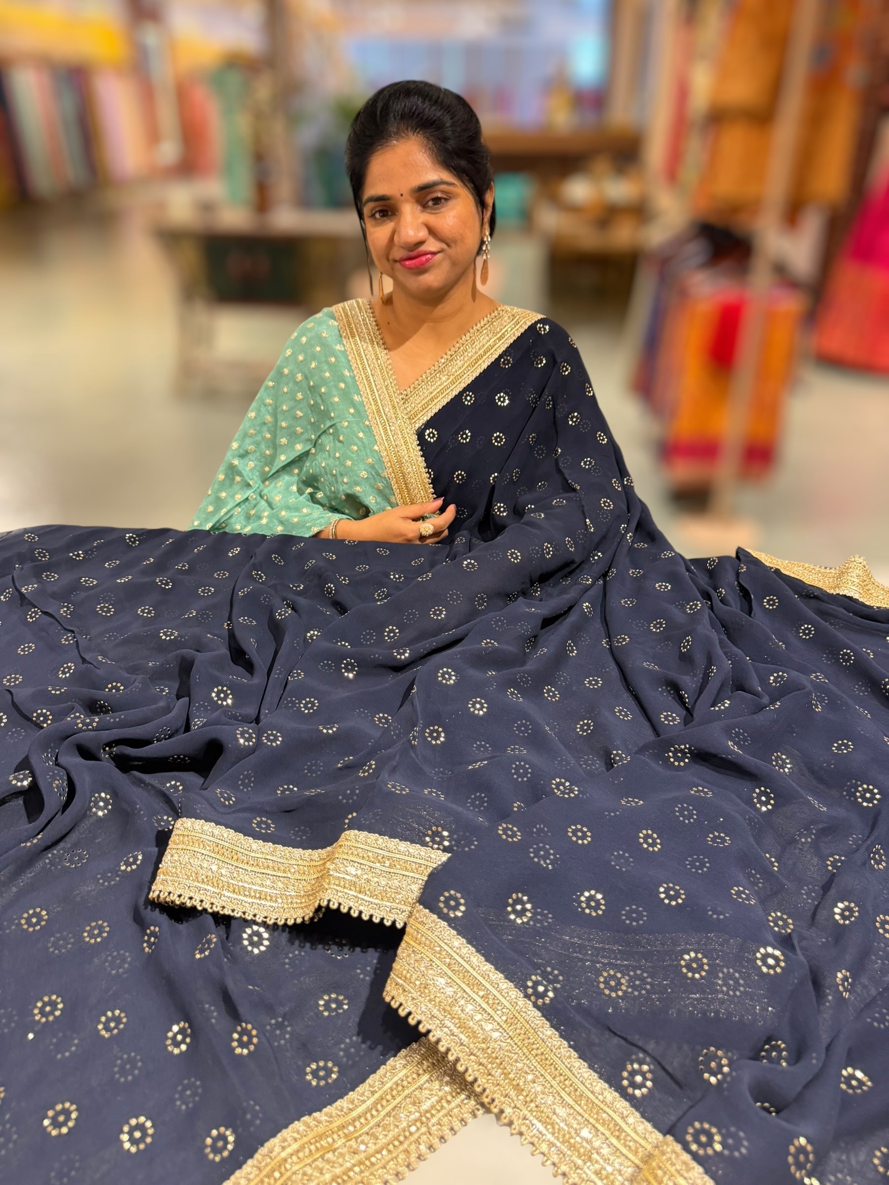 Midnight blue Georgette Saree with stick on Badla in flower pattern