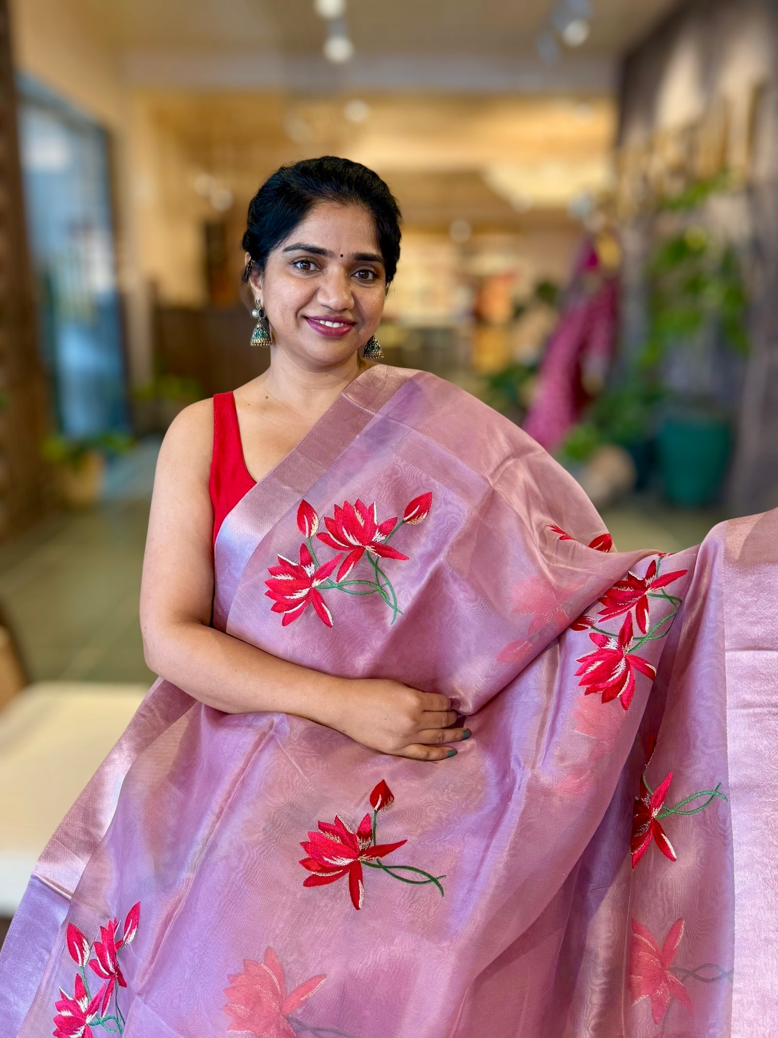 Mauve Organza Saree with Lotus flower embroidery and Satin Borders.
