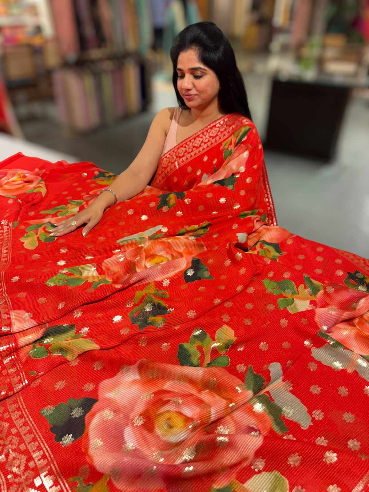 Red georgette sequence saree with statement floral print