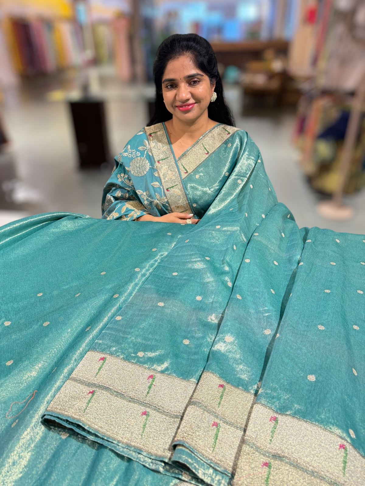 Teal Tissue Saree with pythani inspired muniya borders