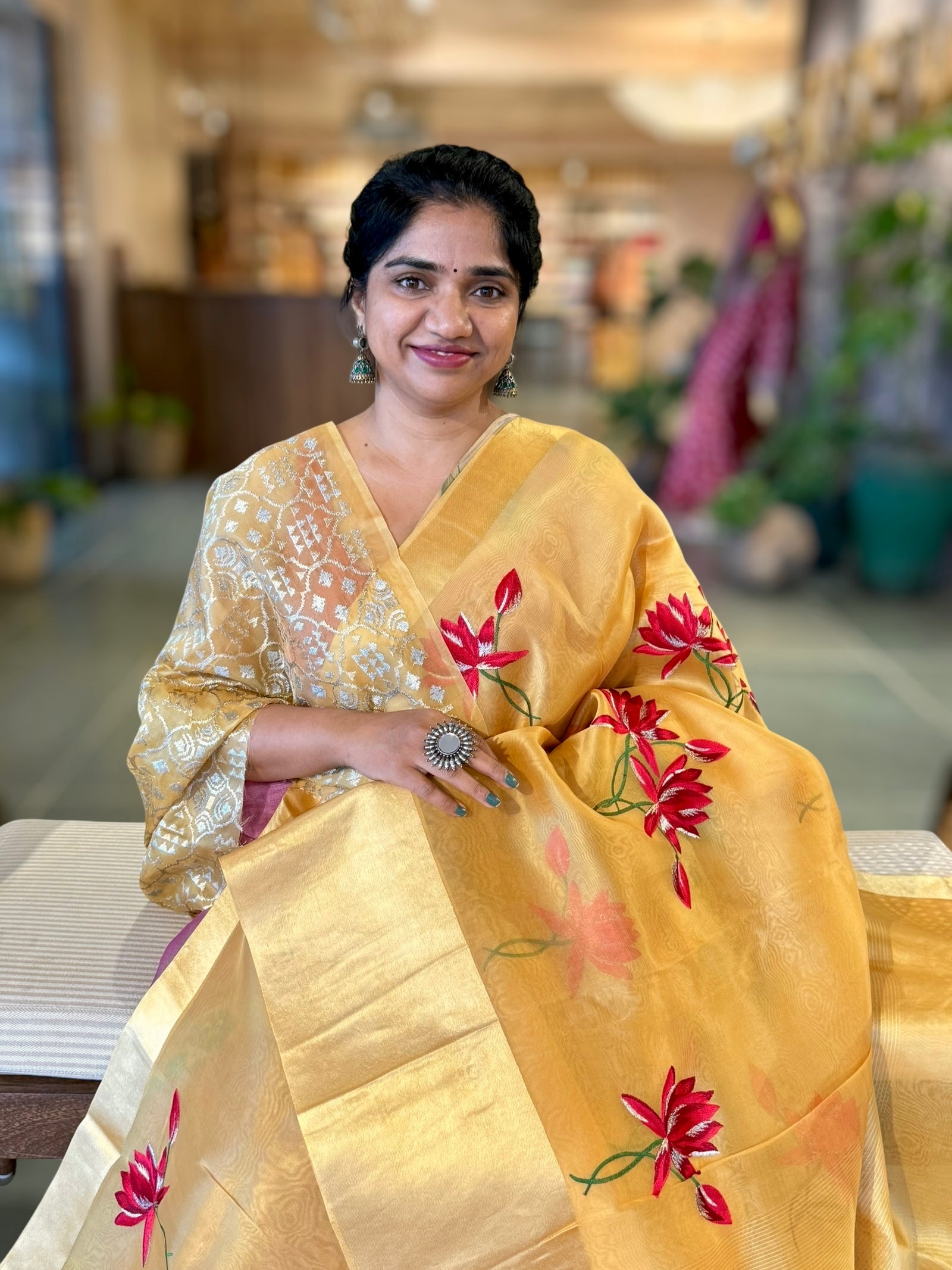 Mustard Organza Saree with Lotus flower embroidery and Satin Borders.