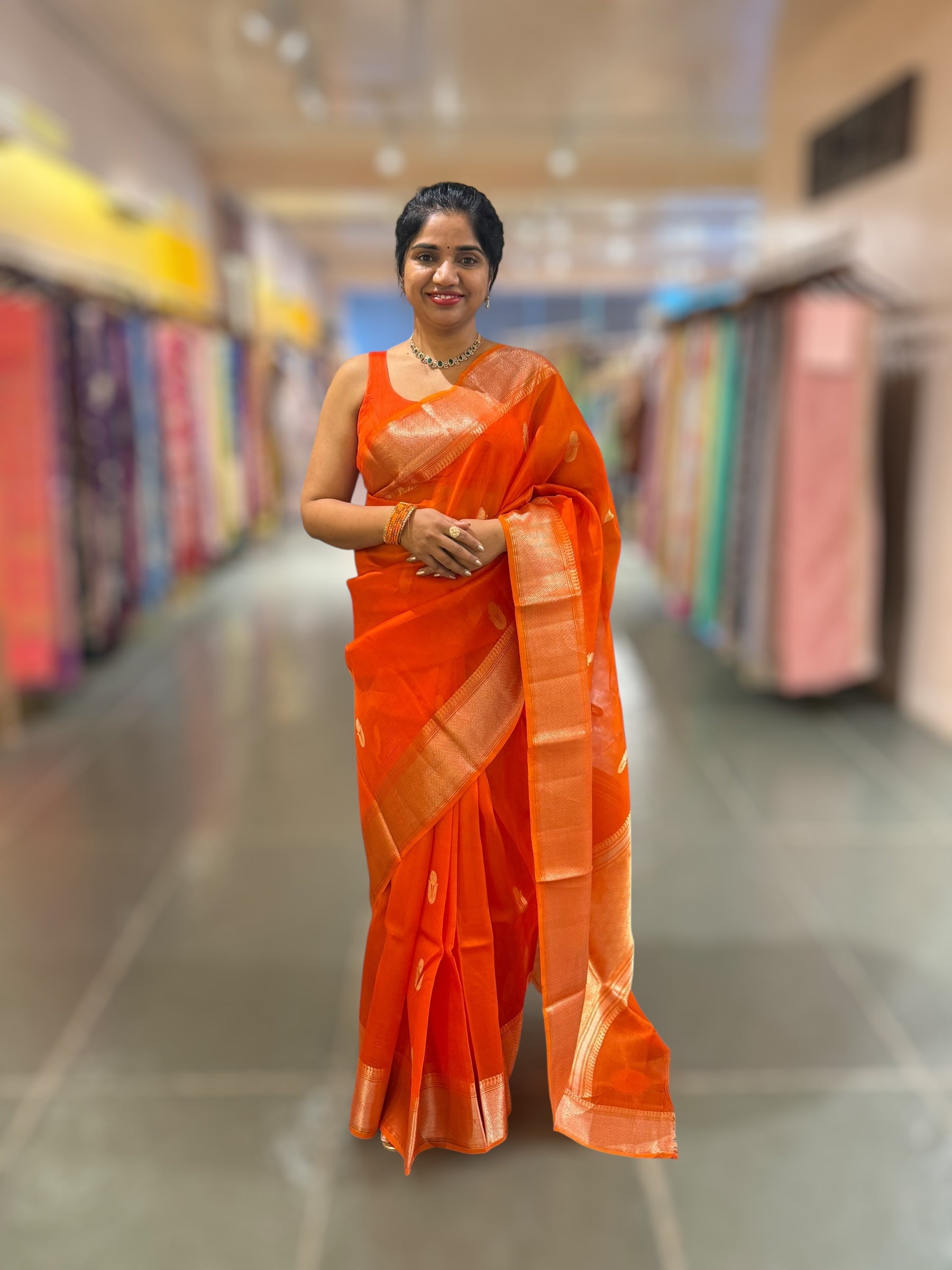 Orange Premium Kora Banarasi Saree with heavy weaving borders and Raw mango style motifs