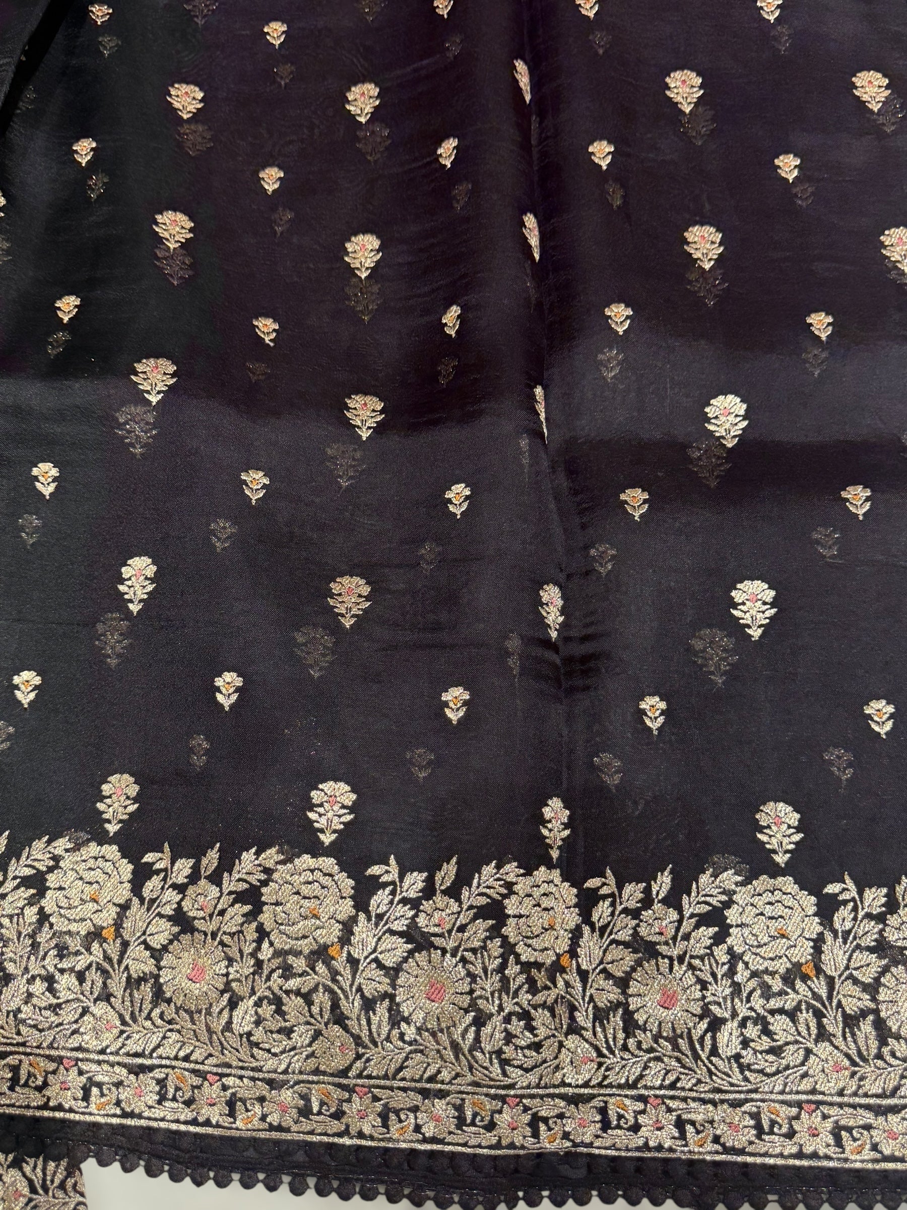 Black Organza Saree with stunning heavy zari embroidered border and alloevr motifs