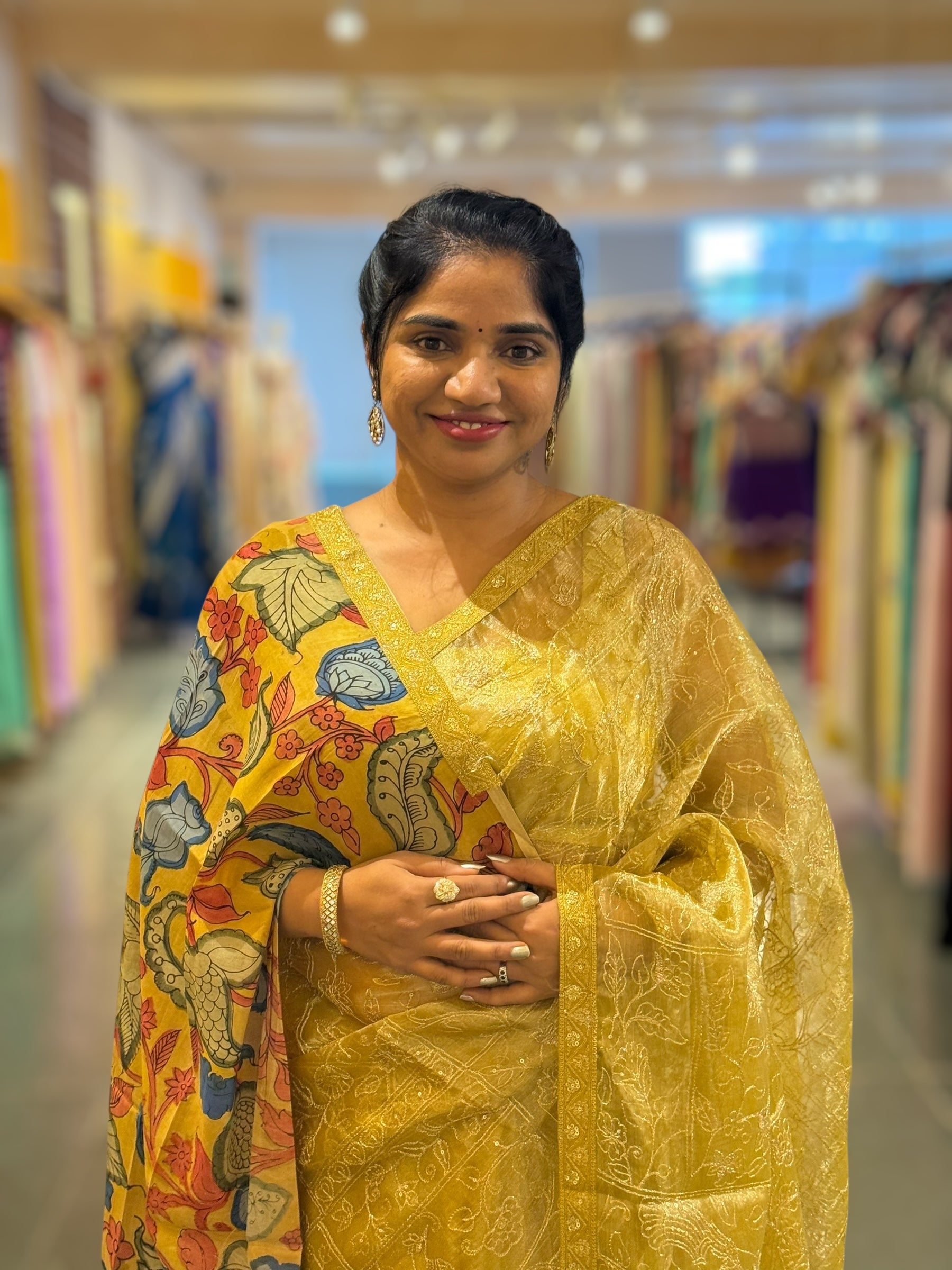 Yellow gold Tissue saree with Allover zari embroidery hemlined with sabyasachi borders & paired with pen kalamkari blouse