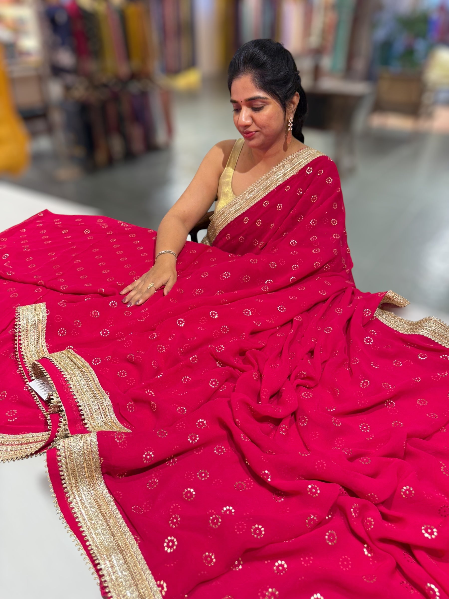 Dark Pink Georgette Saree with stick on Badla in flower pattern