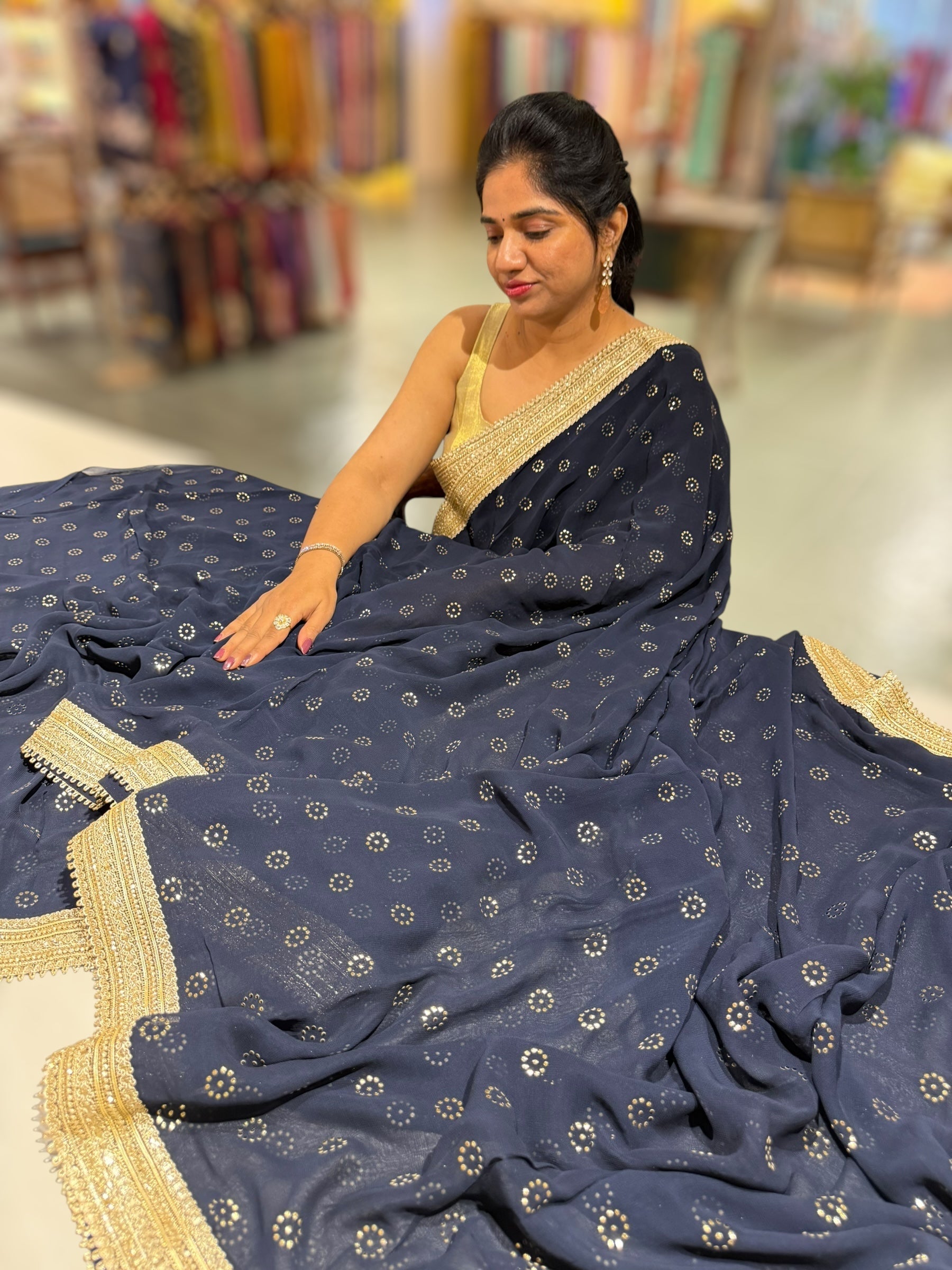 Midnight blue Georgette Saree with stick on Badla in flower pattern