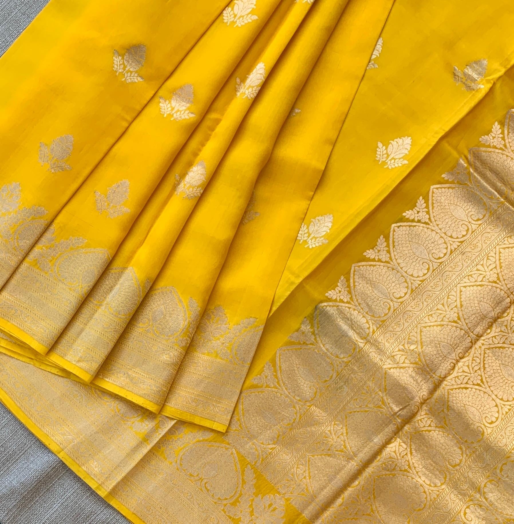 Yellow Raw Mangoe Silk Saree in Monotone Look with heavy weaving borders & kaduwa woven motifs.