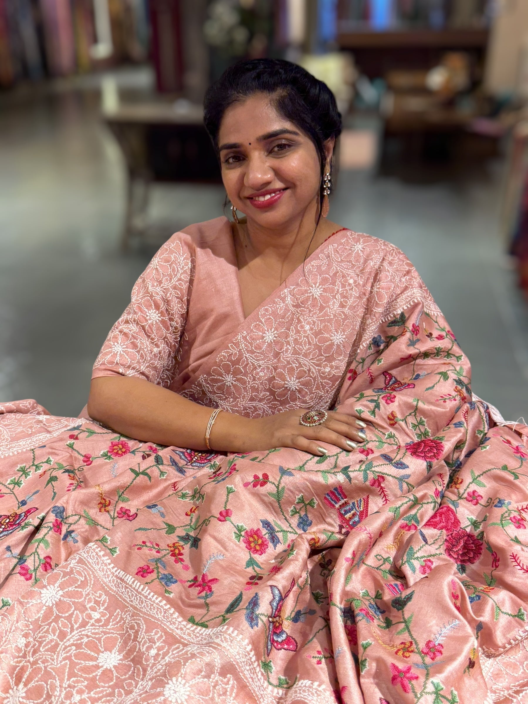 Peach Pink Tussar Saree with lucknowi border and pallu with allover petite point embroidery.