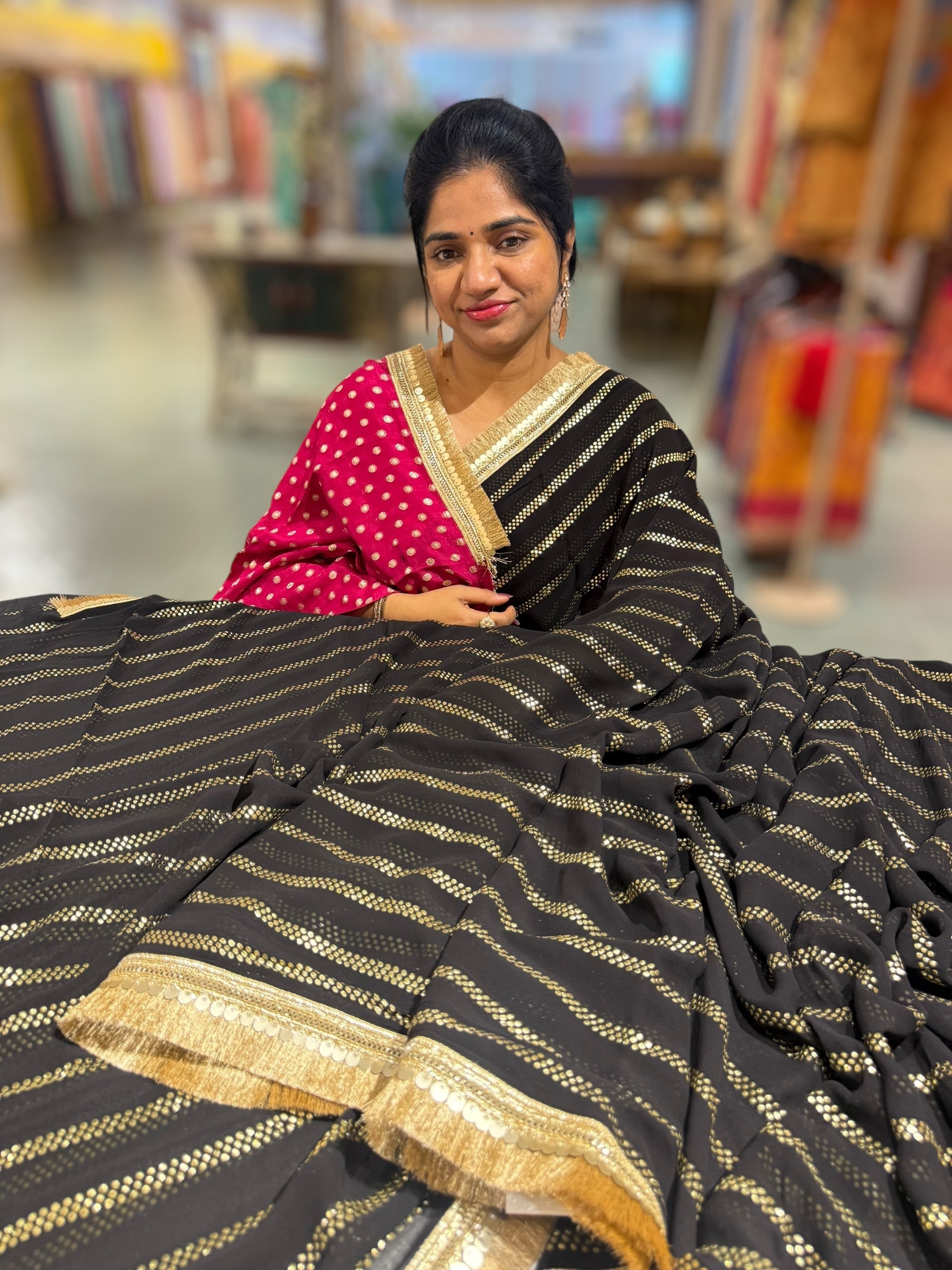 Black Georgette Saree with stick on Badla in stripes pattern and kiran Lace