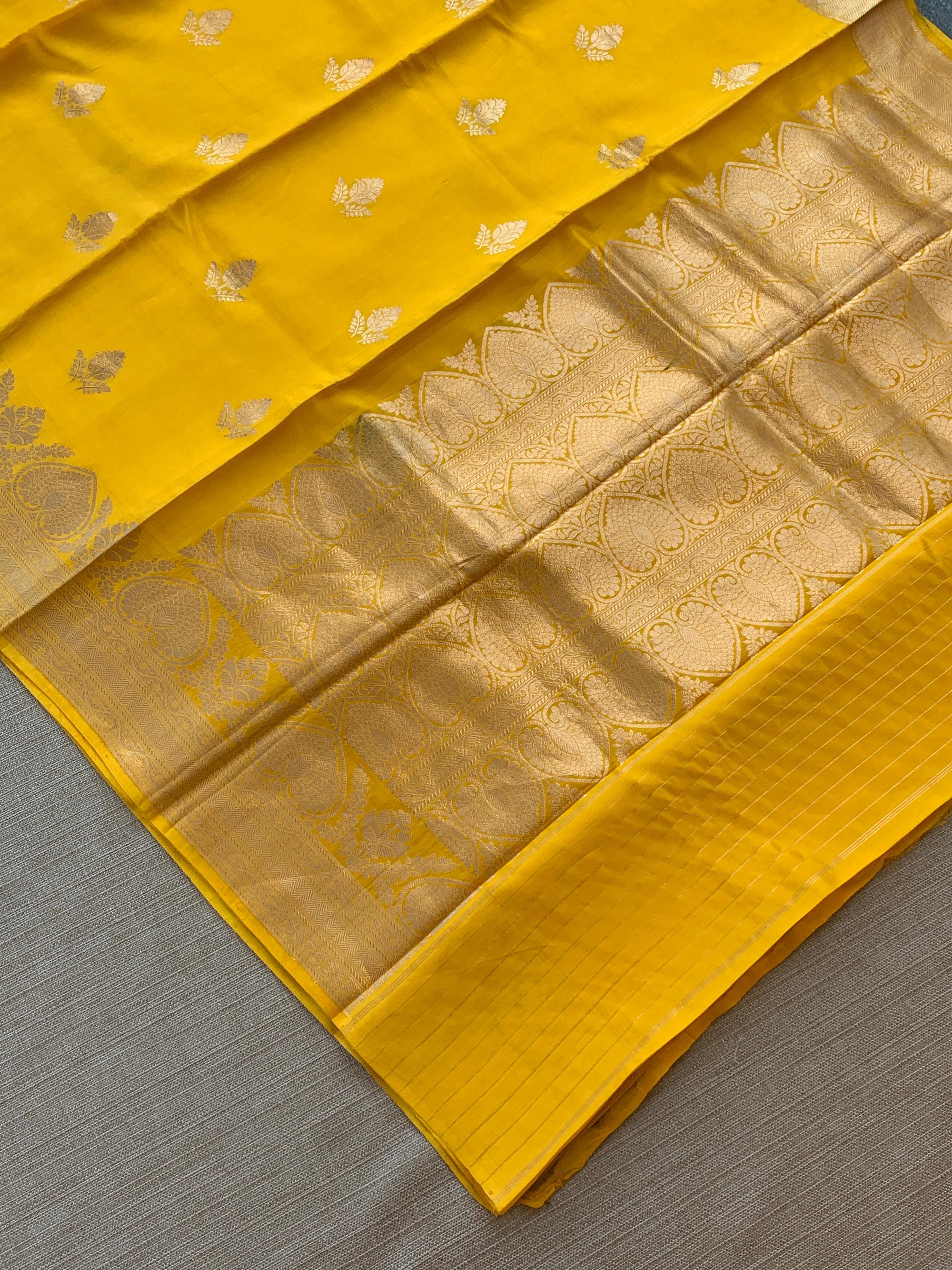 Yellow Raw Mangoe Silk Saree in Monotone Look with heavy weaving borders & kaduwa woven motifs.