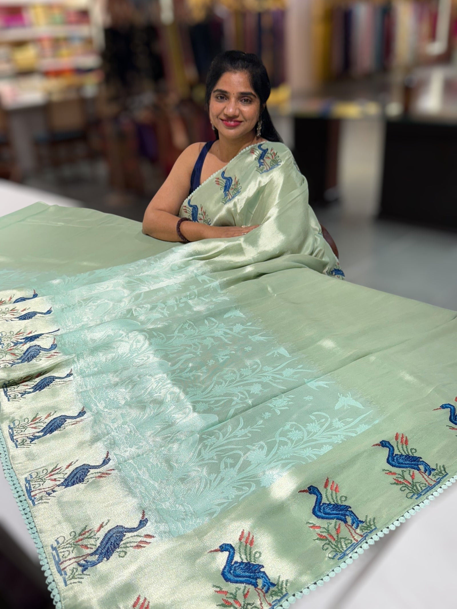 Mint Blue Banarasi Brocade tissue saree with tonchui style weaving & petite point embroidered swan border