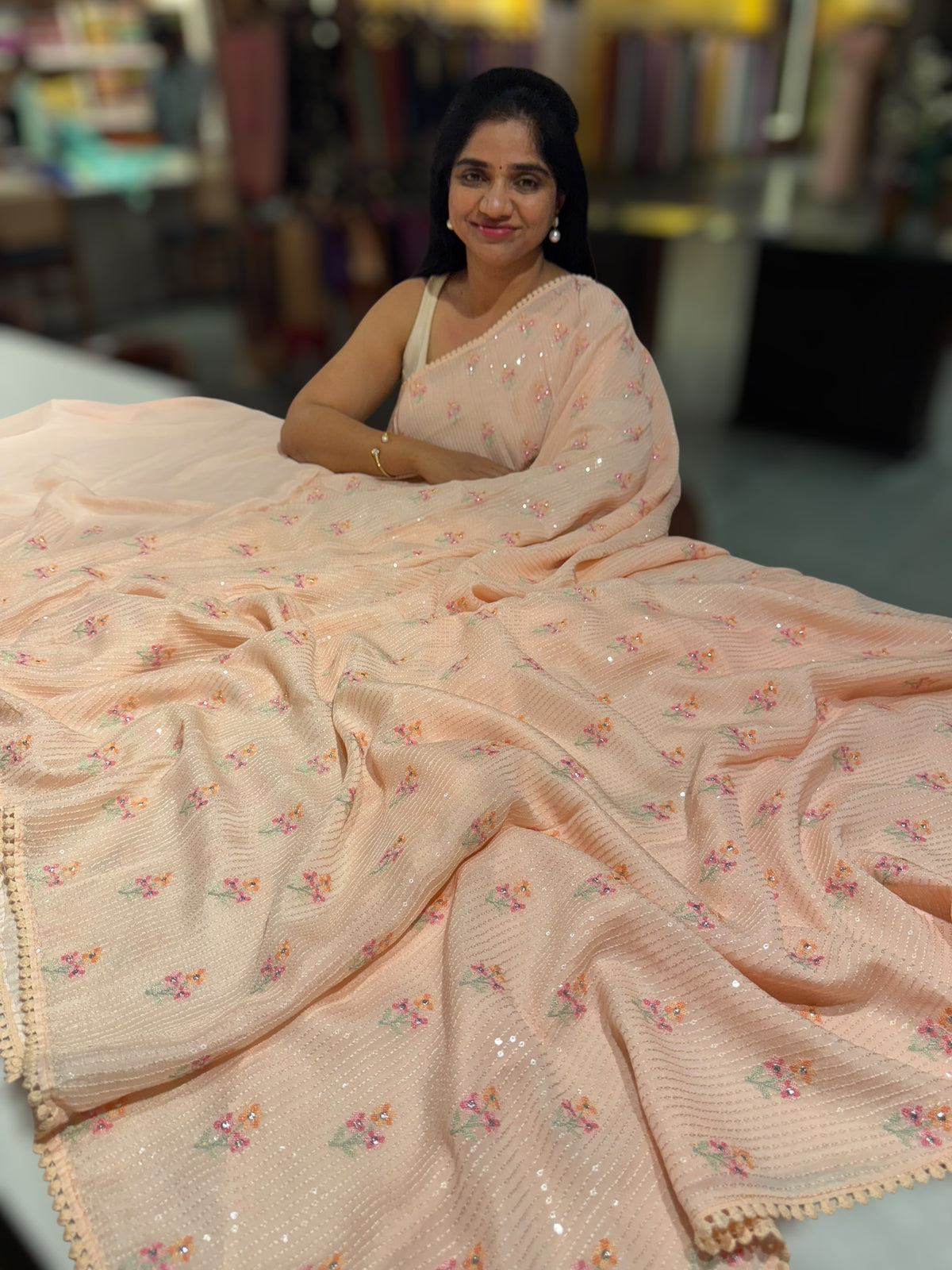 Light peach chiffon saree with embroidery