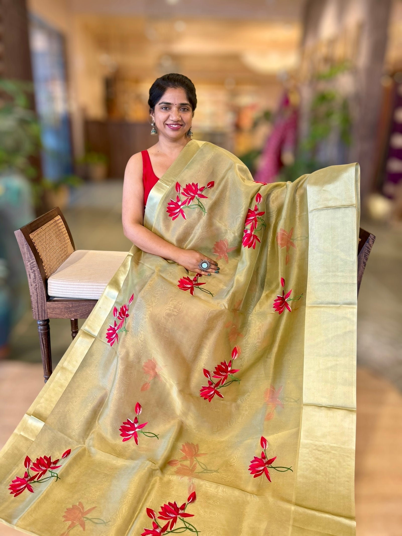 Olive Green Organza Saree with Lotus flower embroidery and Satin Borders.