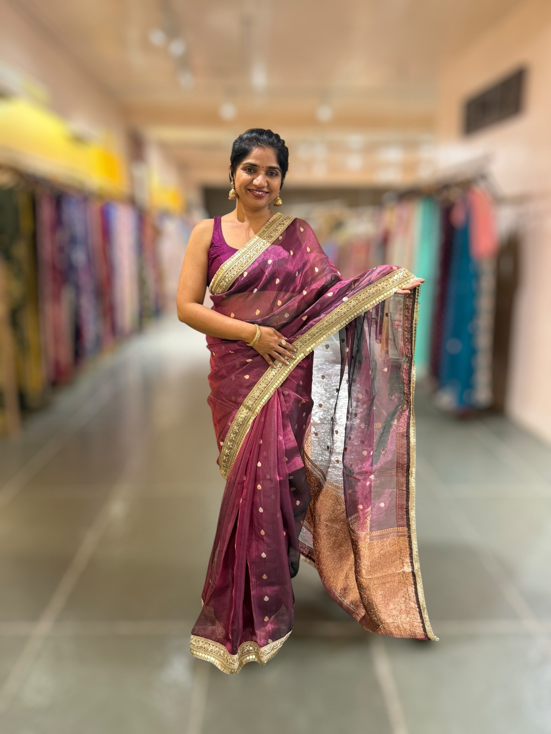 Wine Pure handloom Banarasi Tissue saree hemlined with Sabhyasachi style fringe laces .