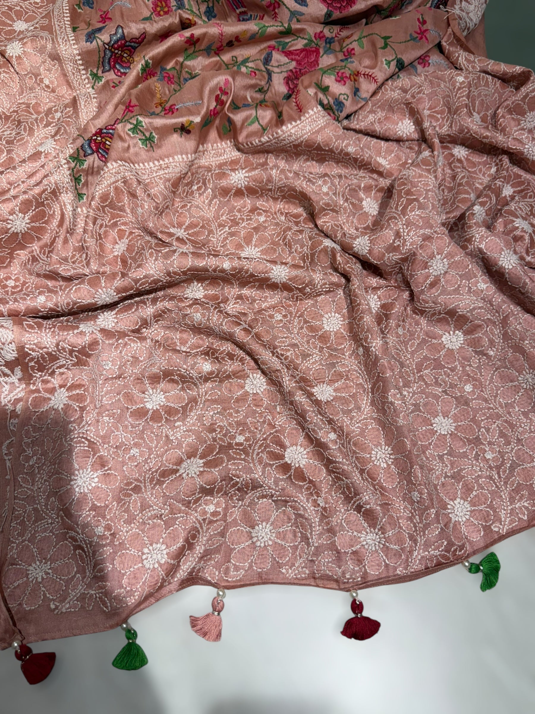 Peach Pink Tussar Saree with lucknowi border and pallu with allover petite point embroidery.