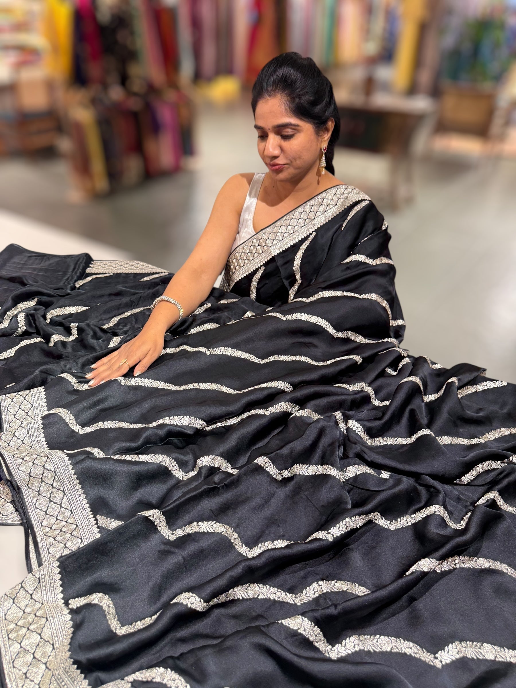 Black Designer Satin Saree with stunning embroidery paired with Silver tissue Pythani embroidered blouse
