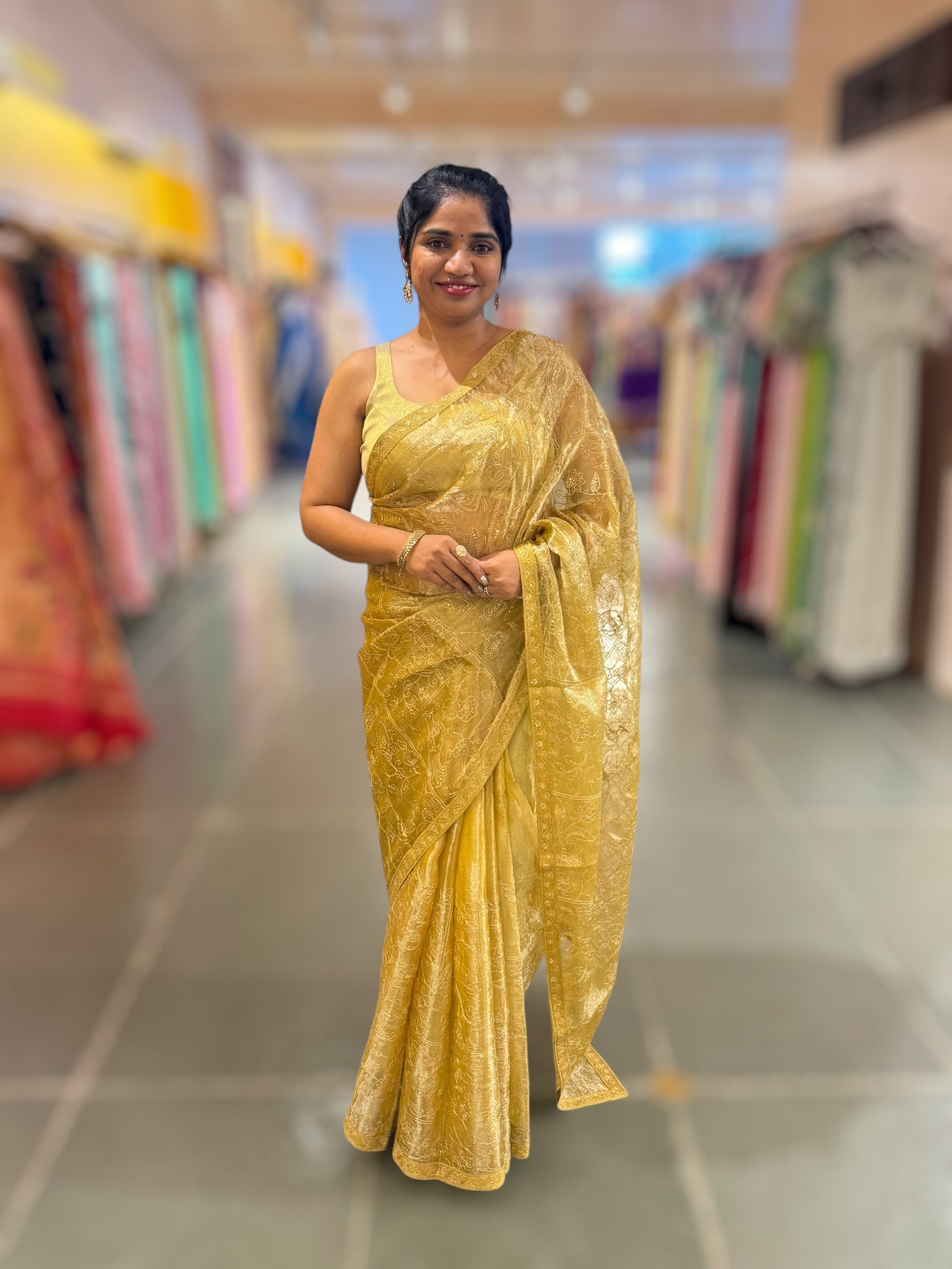 Yellow gold Tissue saree with Allover zari embroidery hemlined with sabyasachi borders & paired with pen kalamkari blouse