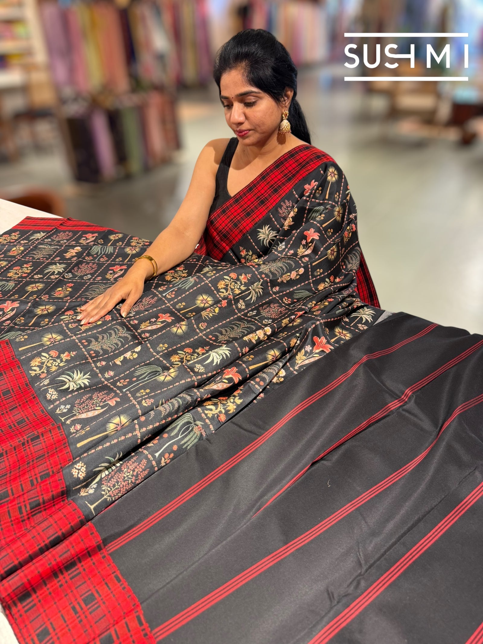 Black printed soft silk saree with burberry checks border : D62F035