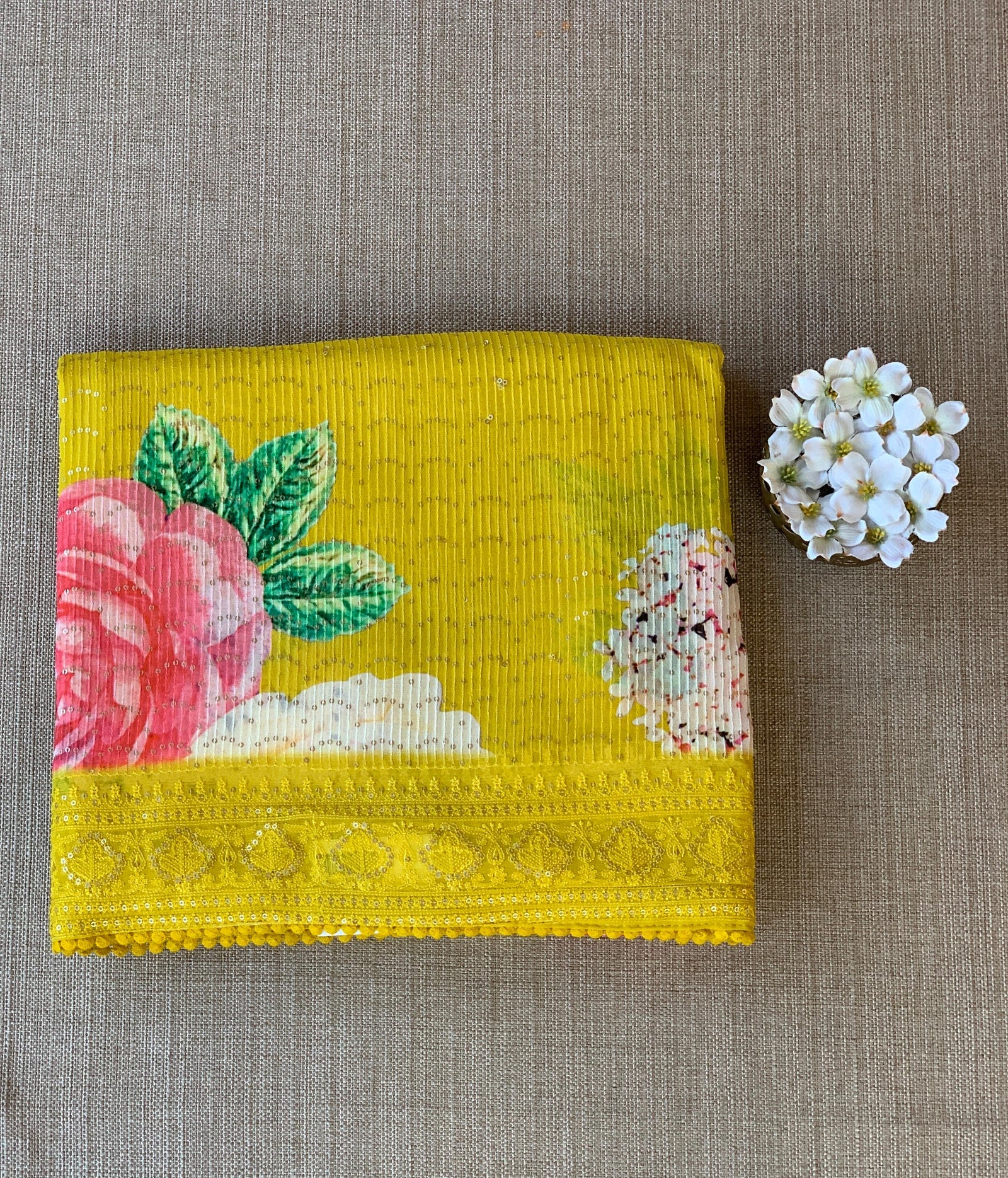 Yellow georgette sequence saree with statement floral print