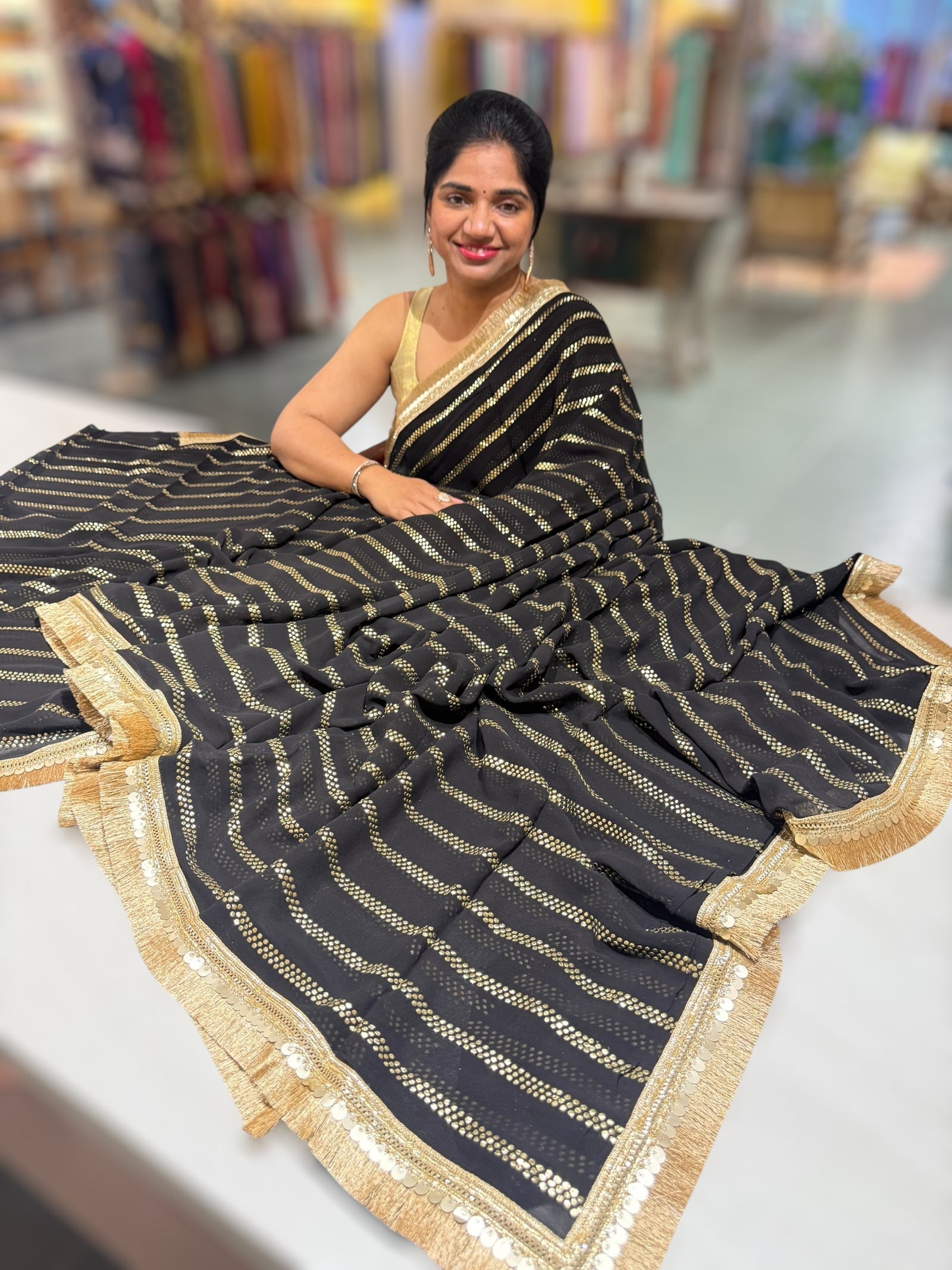 Black Georgette Saree with stick on Badla in stripes pattern and kiran Lace