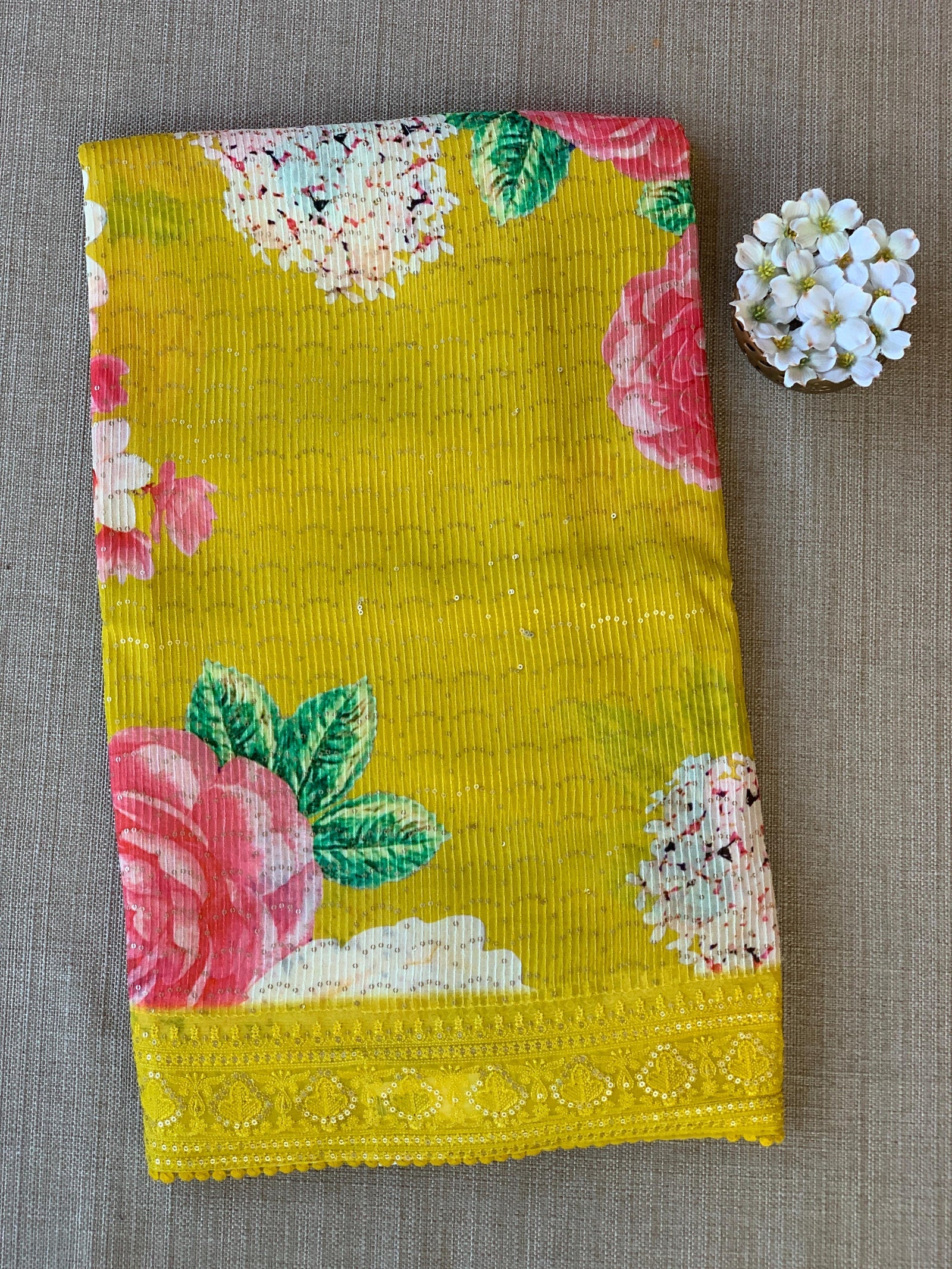 Yellow georgette sequence saree with statement floral print