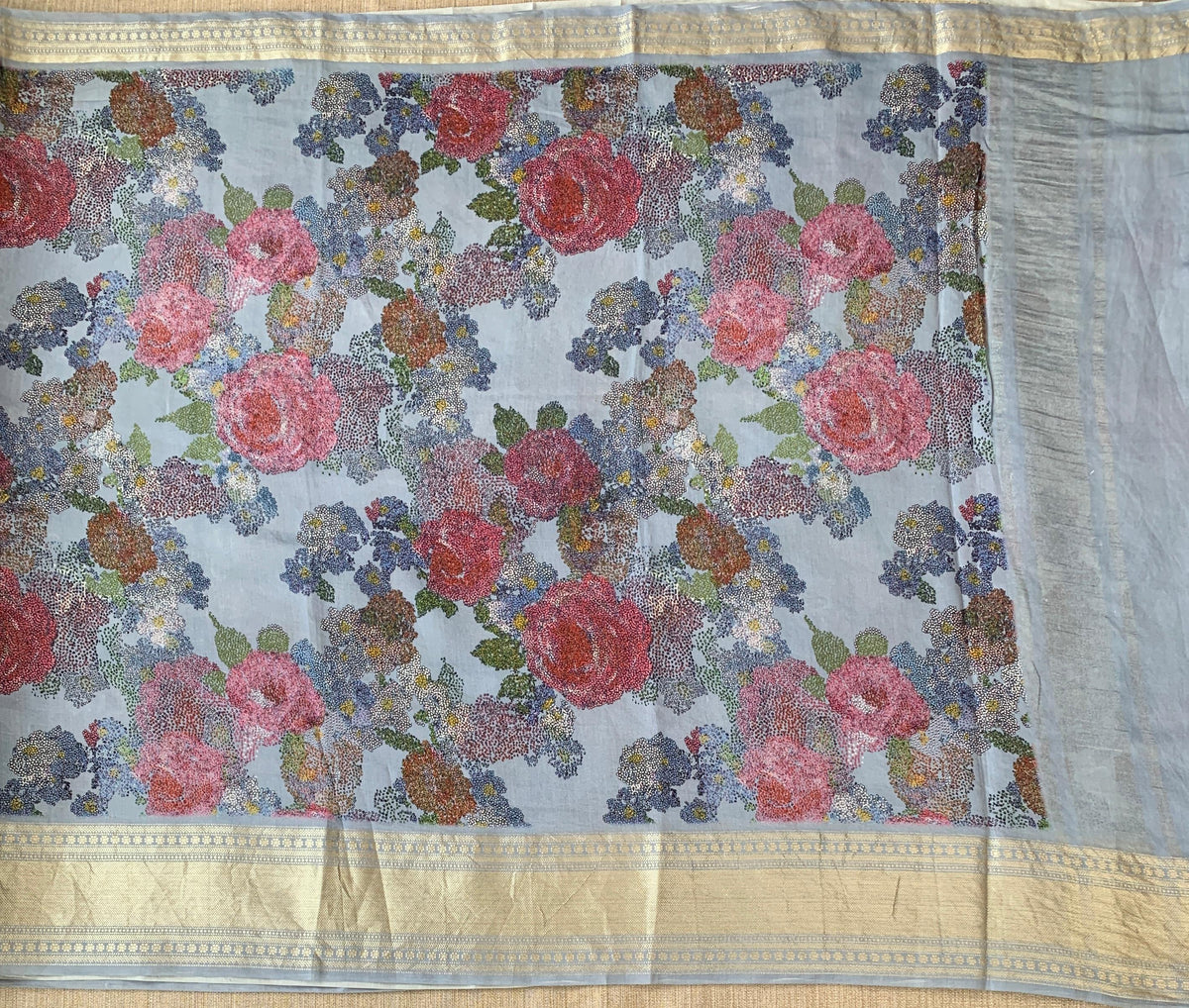 Dusty Blue Pure Handloom Chiniya Silk Saree with stunning Floral Print and zari borders