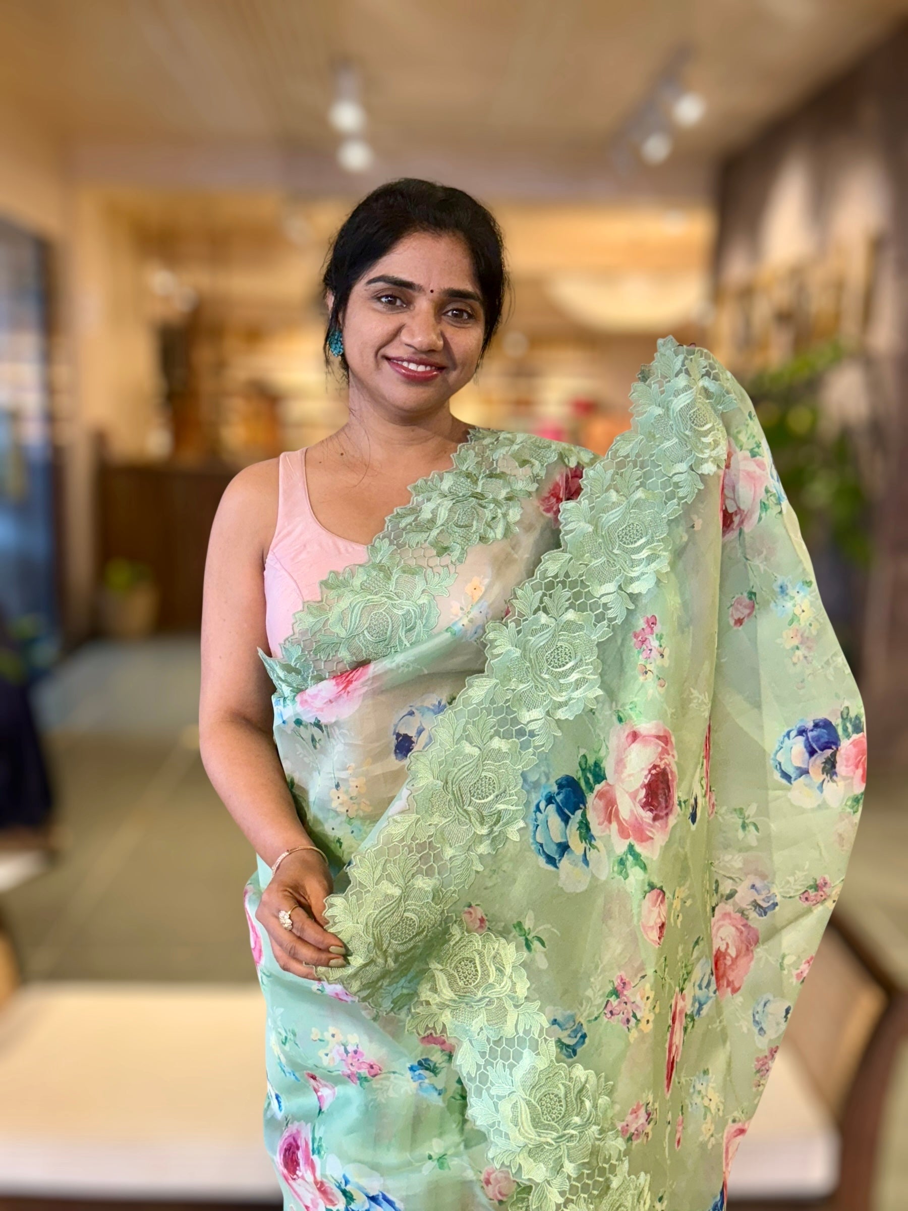 Mint Floral Printed Organza Saree With Chantilly Lace Style Embroidered Border.