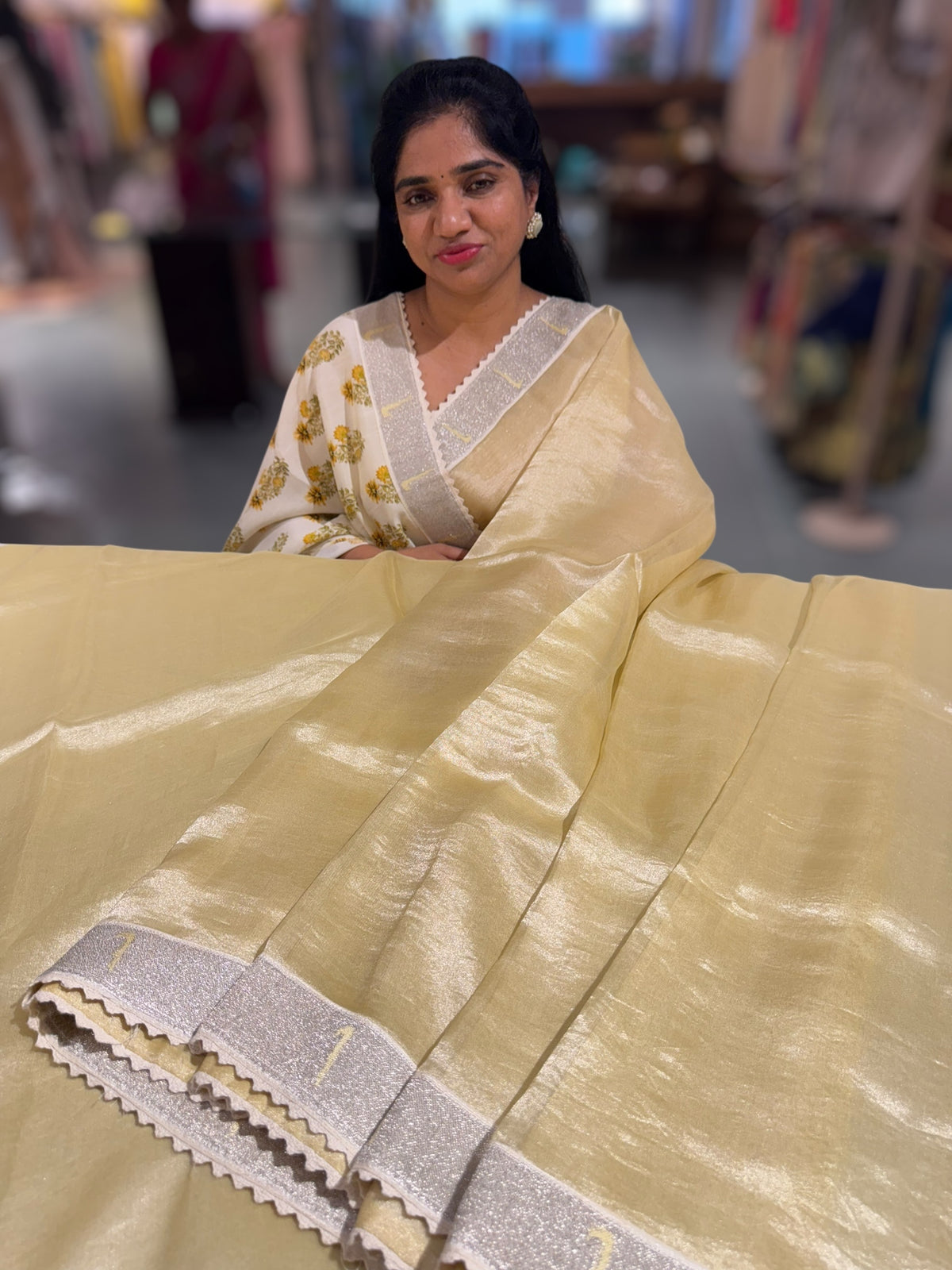 Pastel yellow Tissue Saree with pythani tissue embroidered border