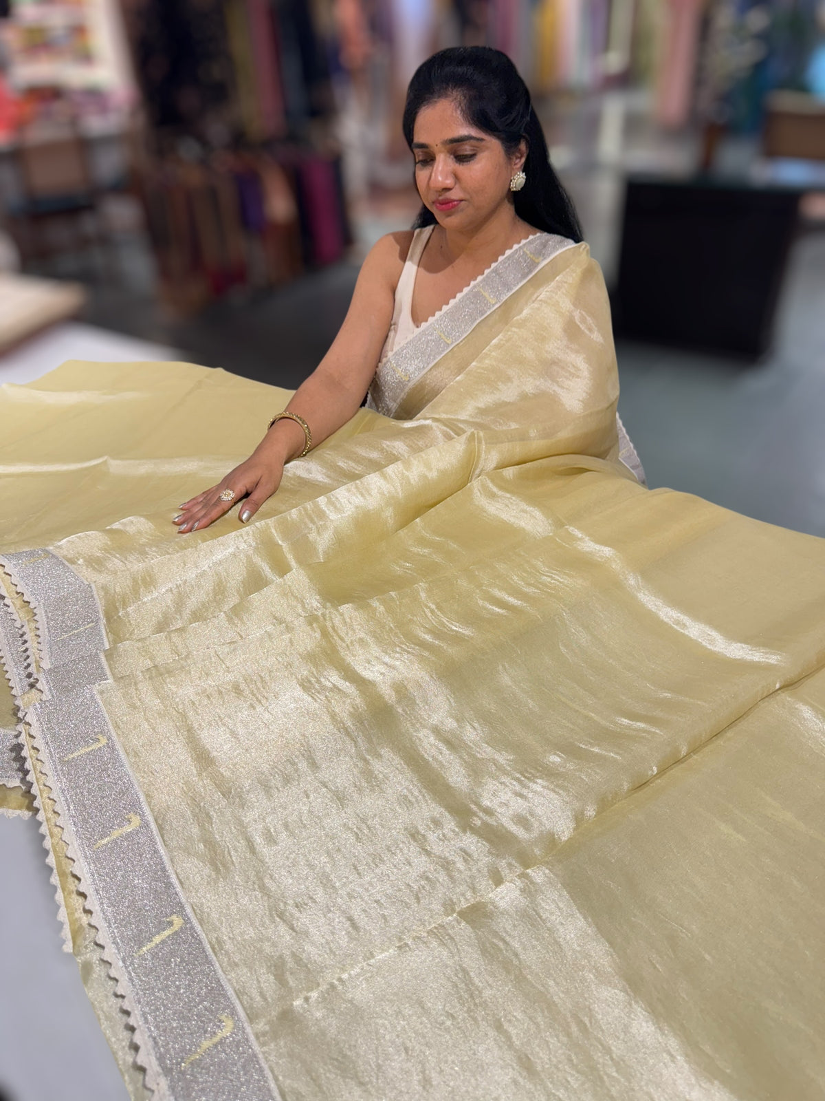 Pastel yellow Tissue Saree with pythani tissue embroidered border
