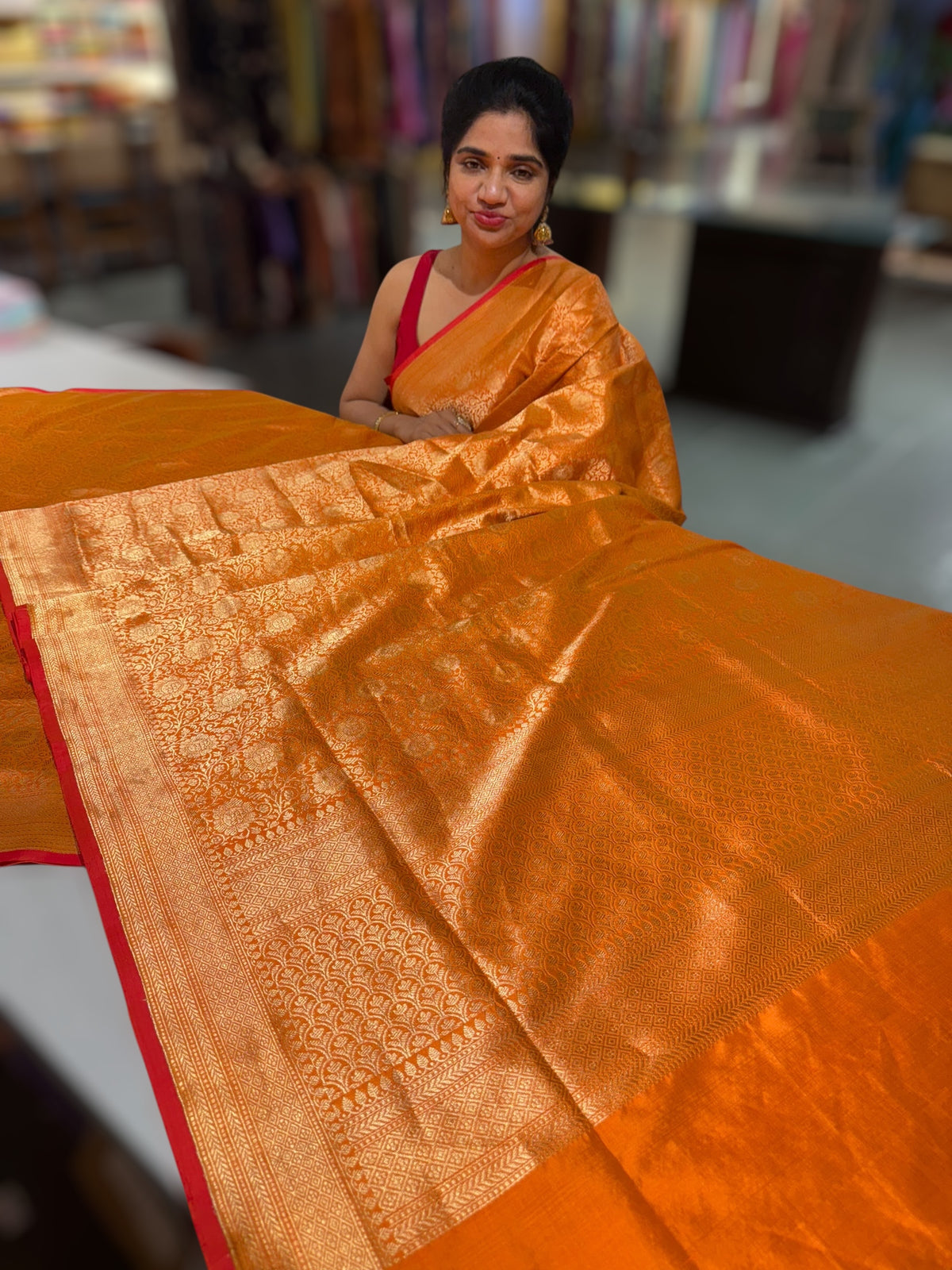Orange Banarasi katan Tonchoi weaving Saree with red selvedge