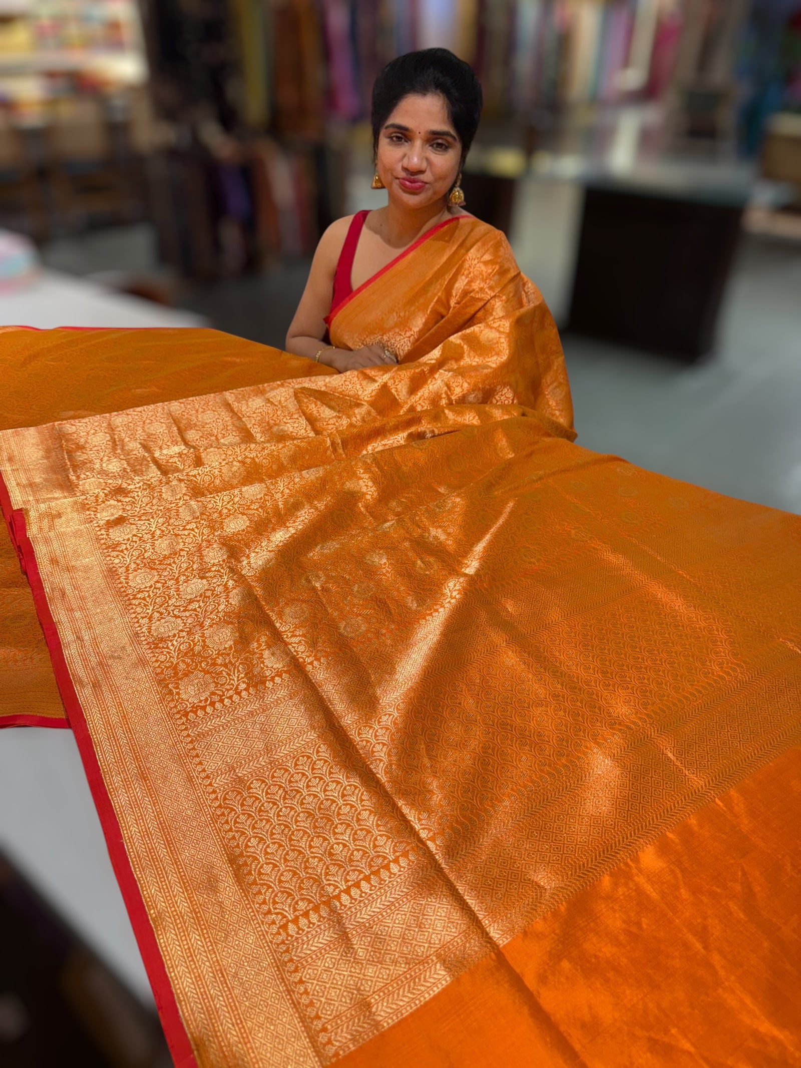 Orange Banarasi katan Tonchoi weaving Saree with red selvedge