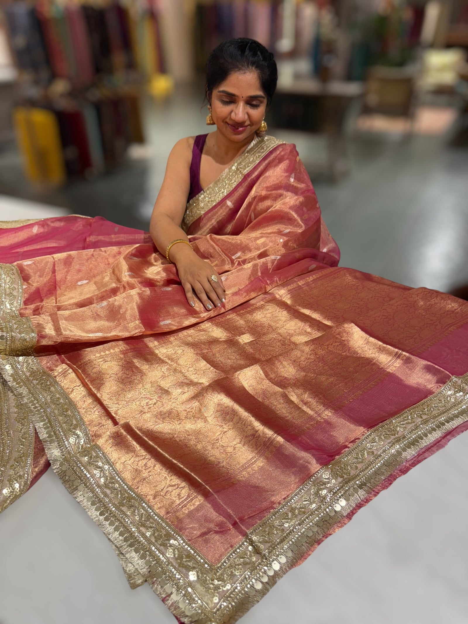 Pink Pure handloom Banarasi Tissue saree hemlined with Sabhyasachi style fringe laces .