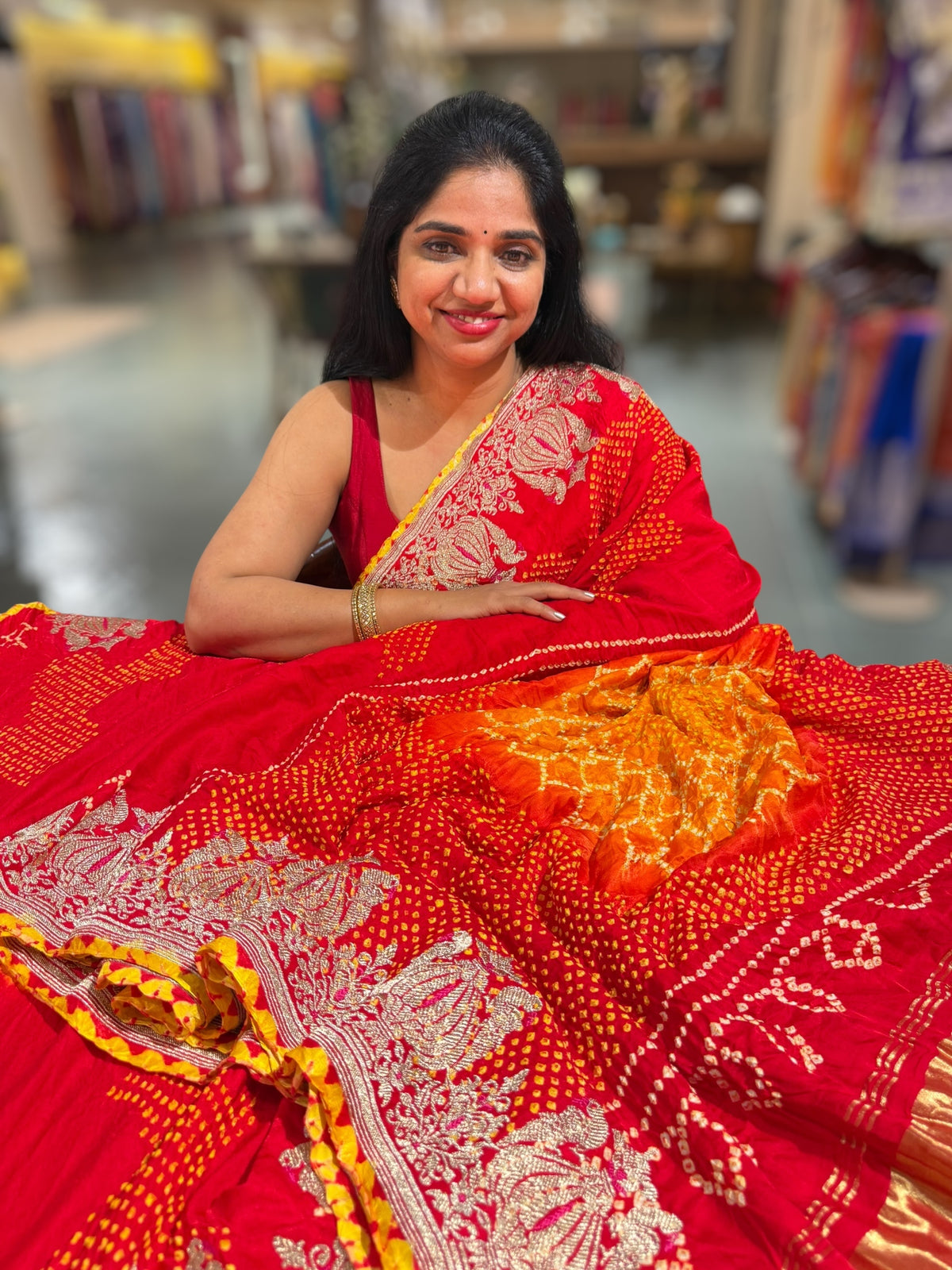 Orangish Red Designer Rai Bandhej Saree With Embroidered Border