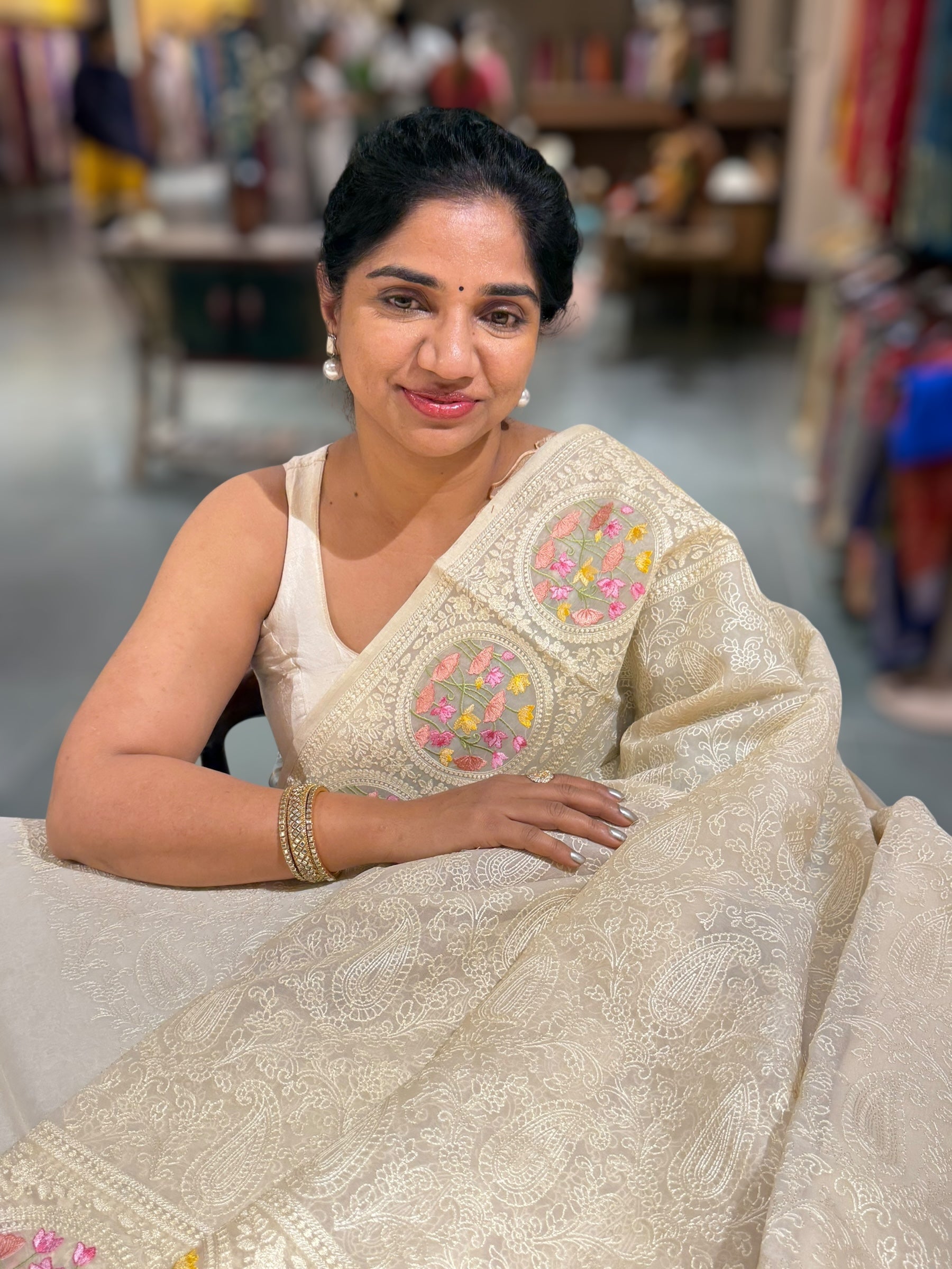Ivory Organza Saree with allover Chikankari Embroidery and pichwai border