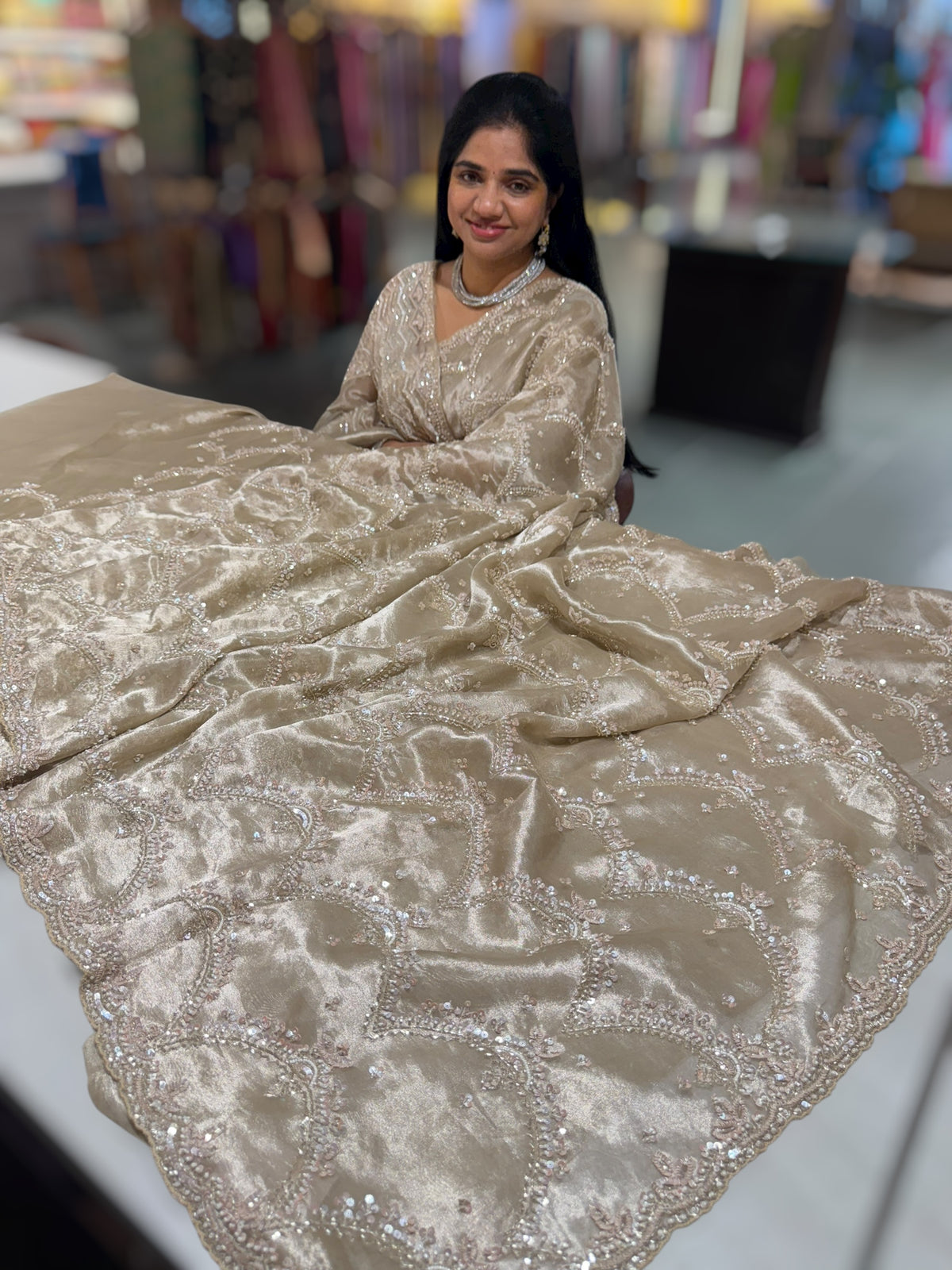 Nude tissue saree with heavy allover intricate handwork
