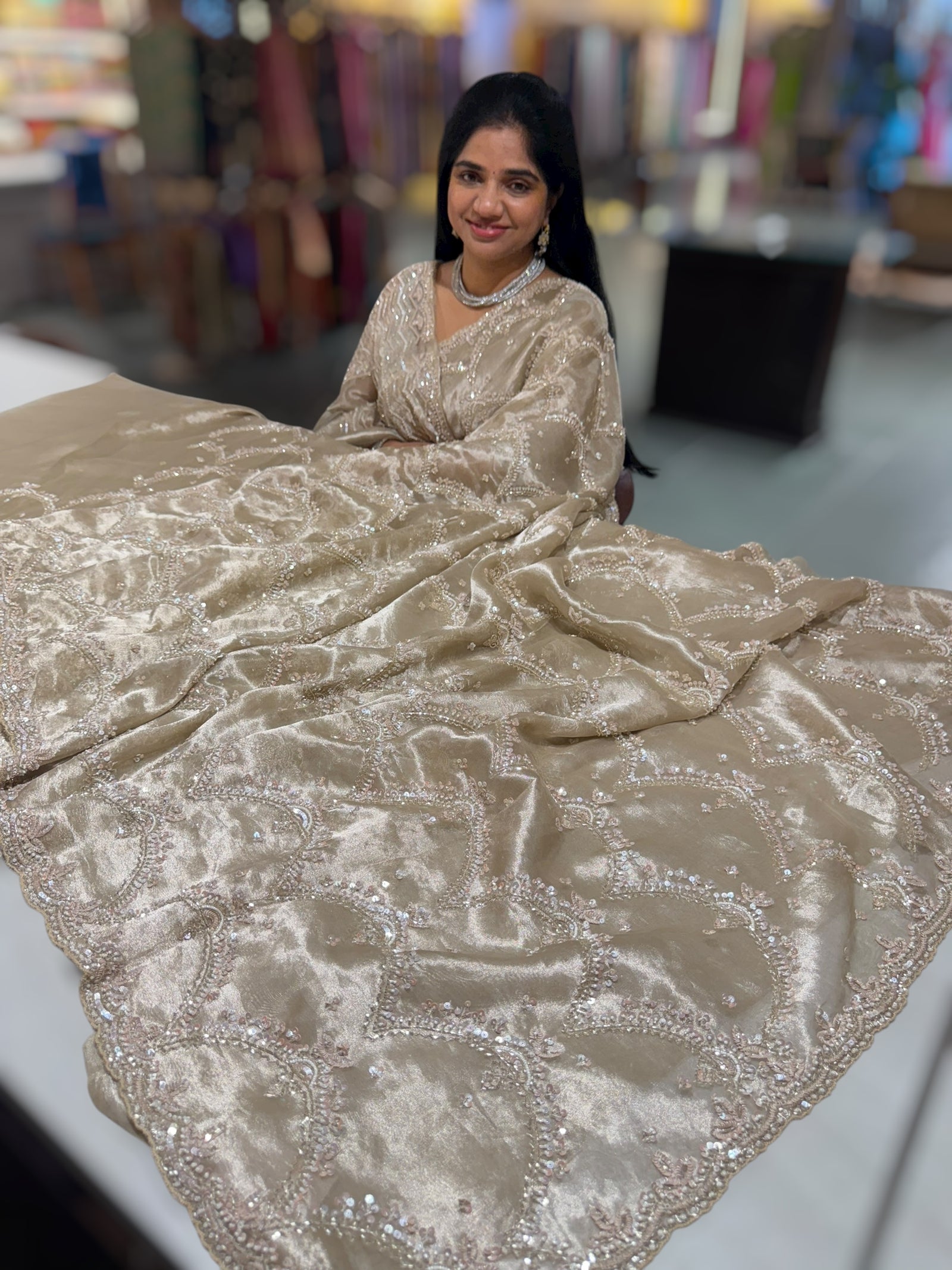 Nude tissue saree with heavy allover intricate handwork