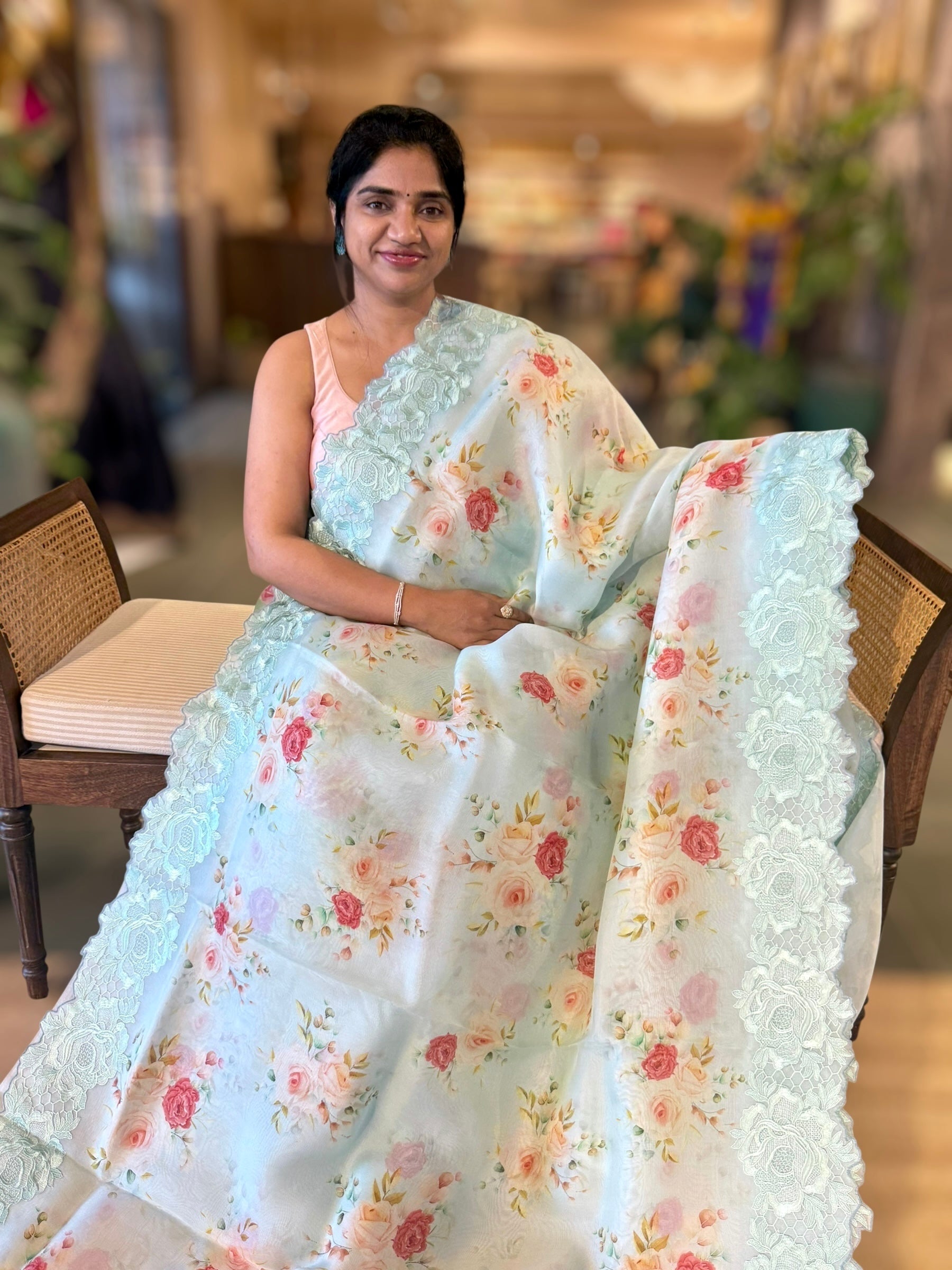 SeaBlue Printed Organza Saree With Chantilly Lace Style Embroidered Border.