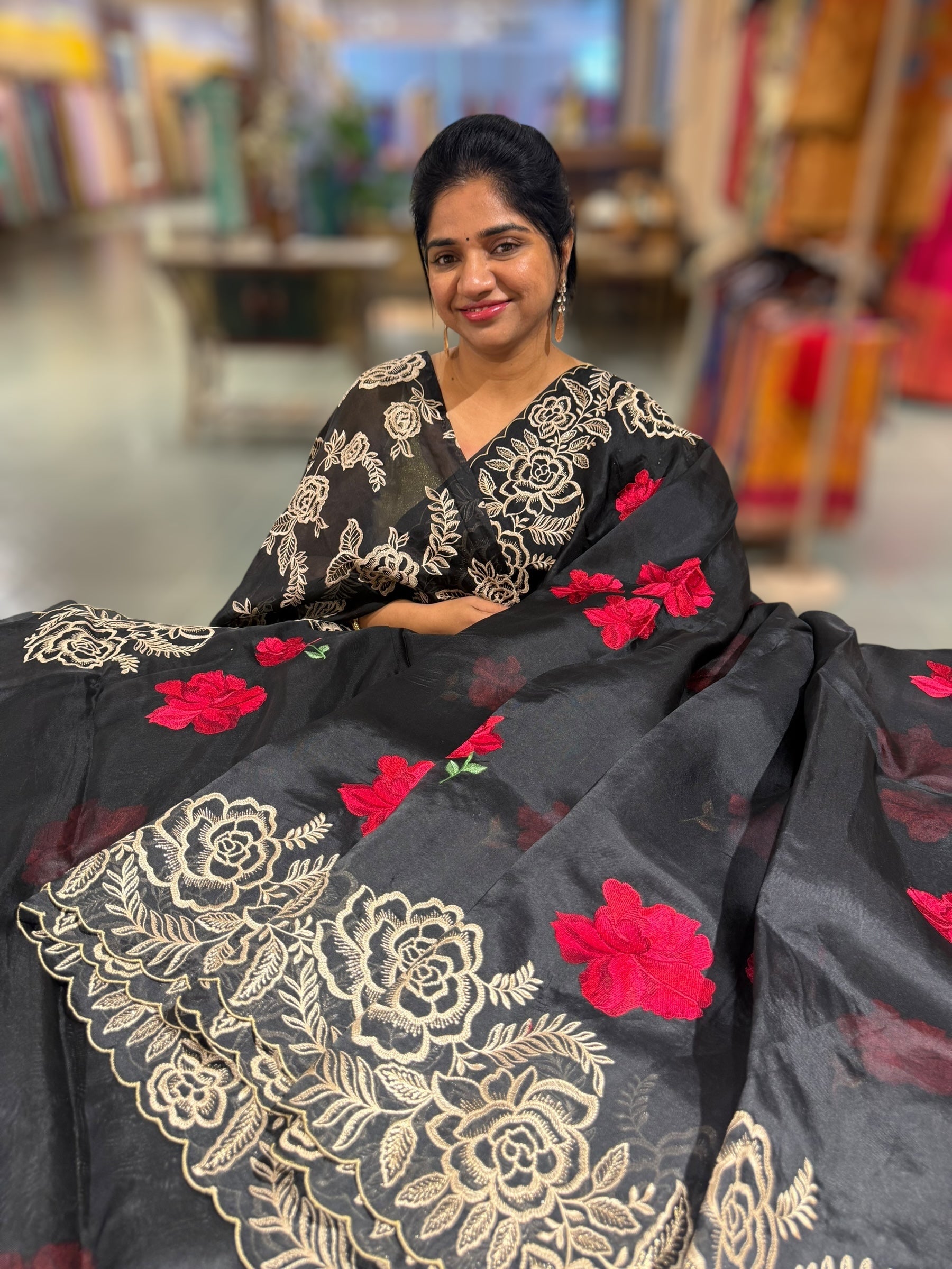 Black Organza Saree with stunning outline floral embroidered cytwork border and red hibuscus flowers allover