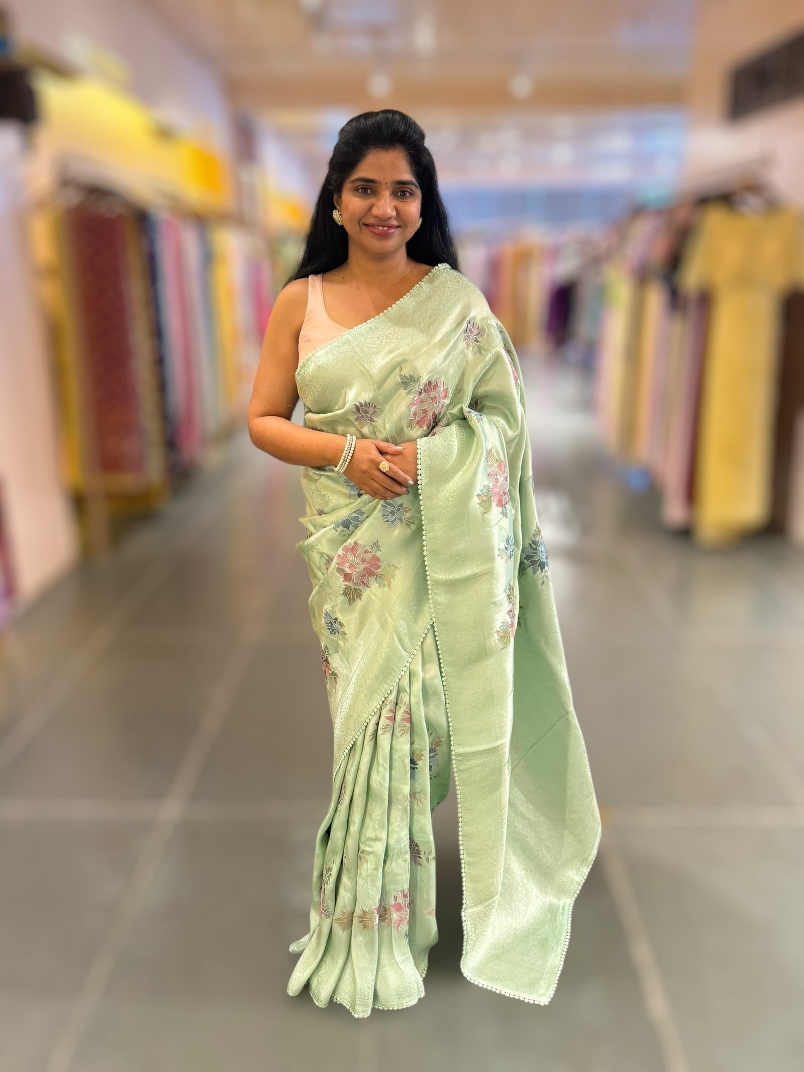 Seagreen Banarasi Brocade tissue saree with allover floral embroidery