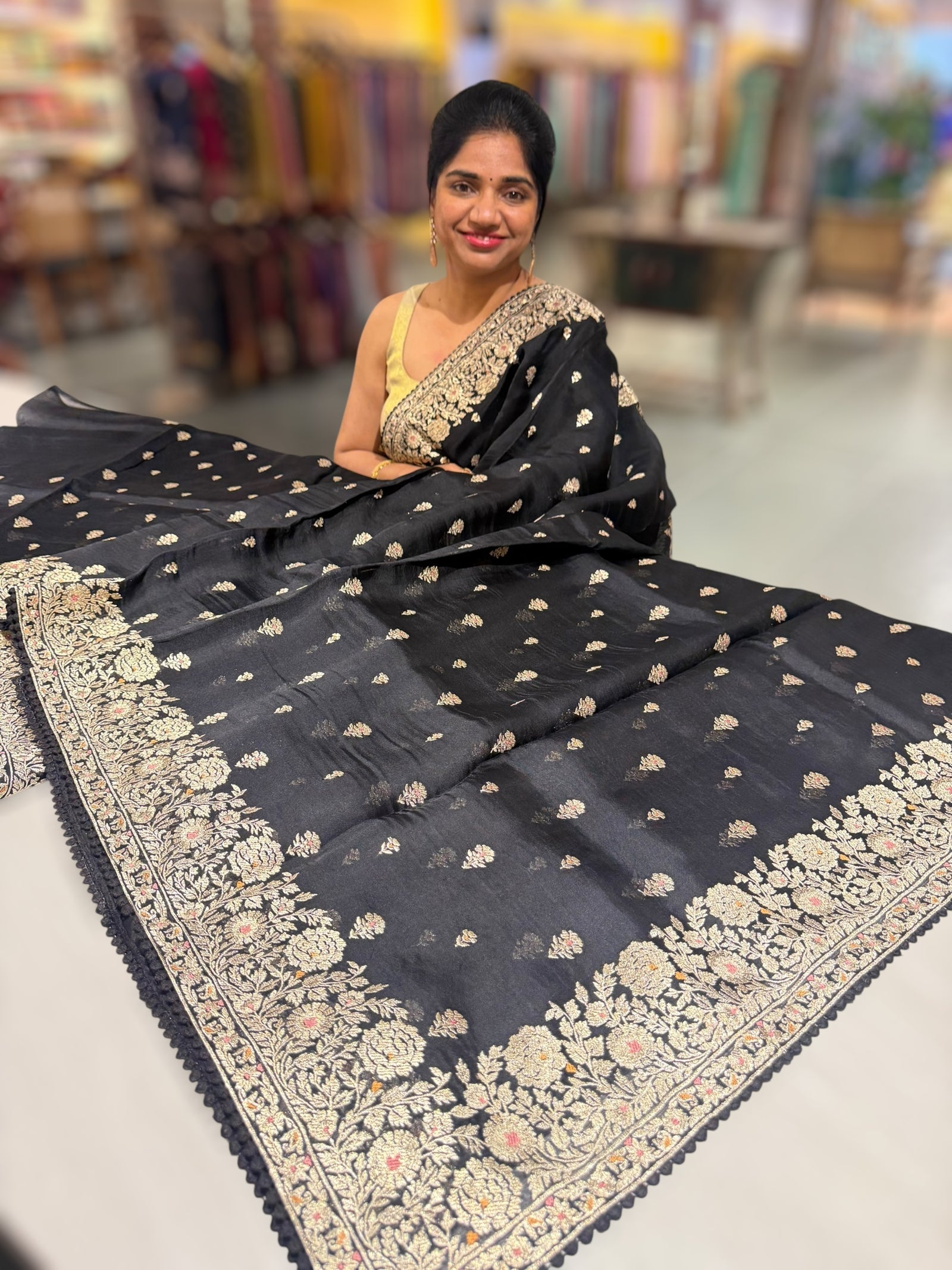 Black Organza Saree with stunning heavy zari embroidered border and alloevr motifs