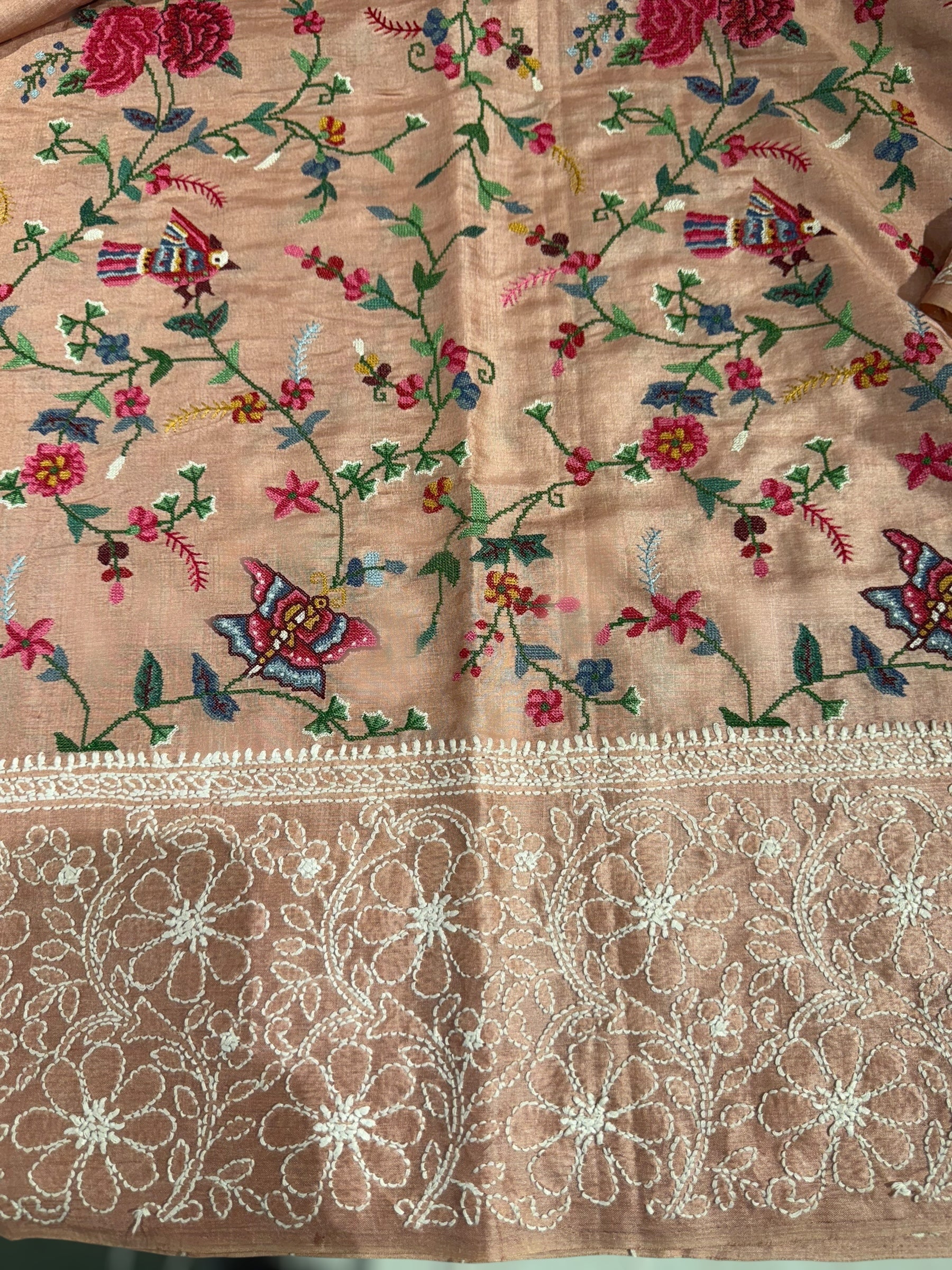 Peach Pink Tussar Saree with lucknowi border and pallu with allover petite point embroidery.
