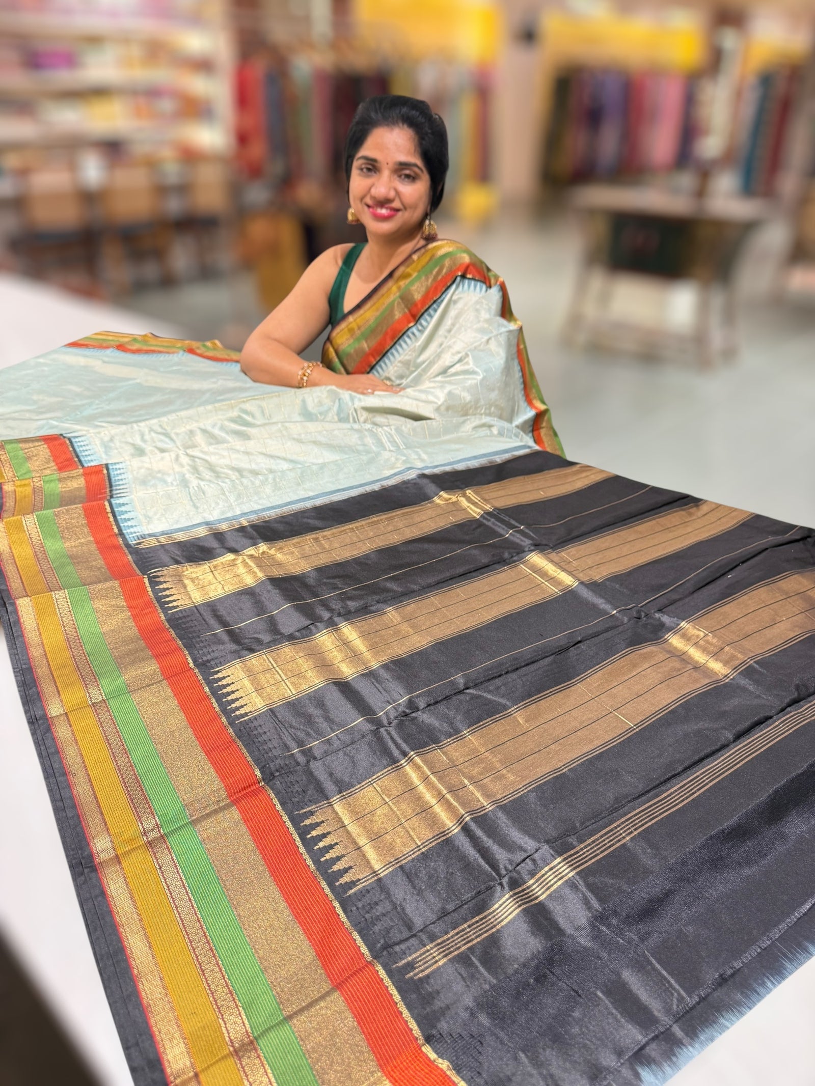 Powder Blue Kanchi vintage style soft silk saree with zari checks & multi color border.
