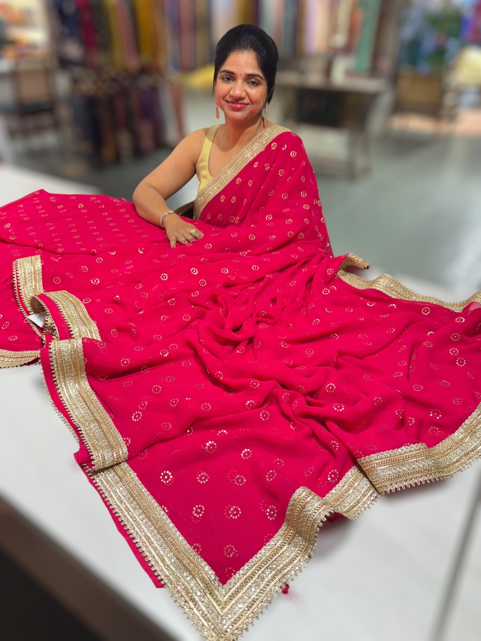 Dark Pink Georgette Saree with stick on Badla in flower pattern