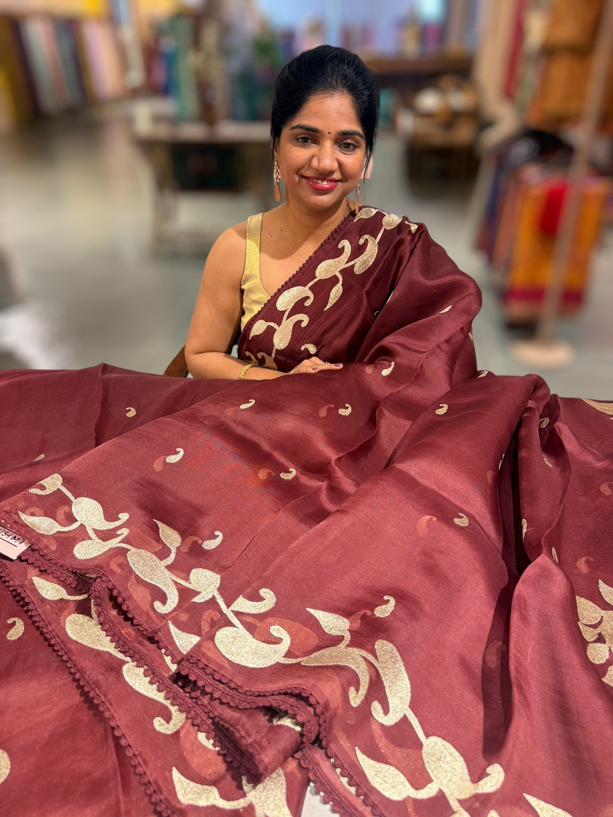 Meroonish Brown Organza Saree with stunning zari embroidered mango border and heavy designer pallu