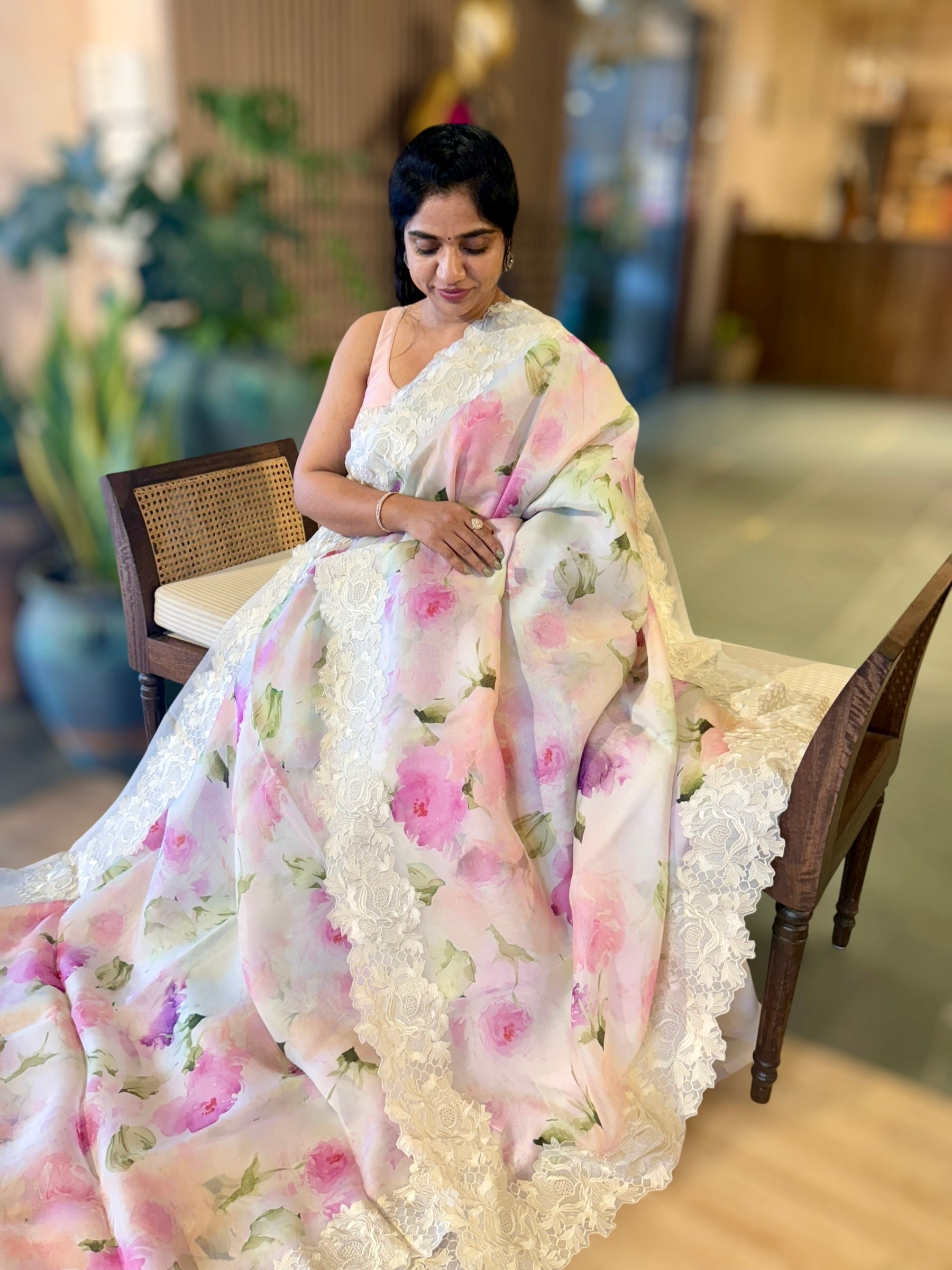 Ivory Printed Organza Saree With Chantilly Lace Style Embroidered Border.