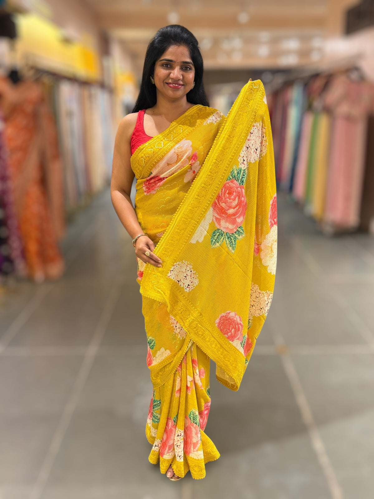 Yellow georgette sequence saree with statement floral print